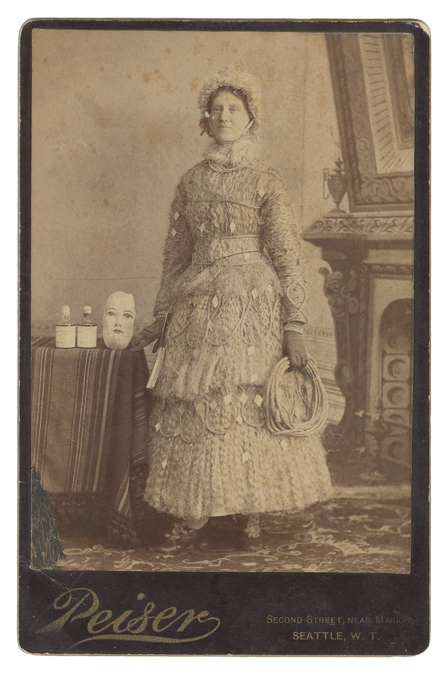 Cabinet photo of a performer in elaborate dress and accessories. (1 of 1)