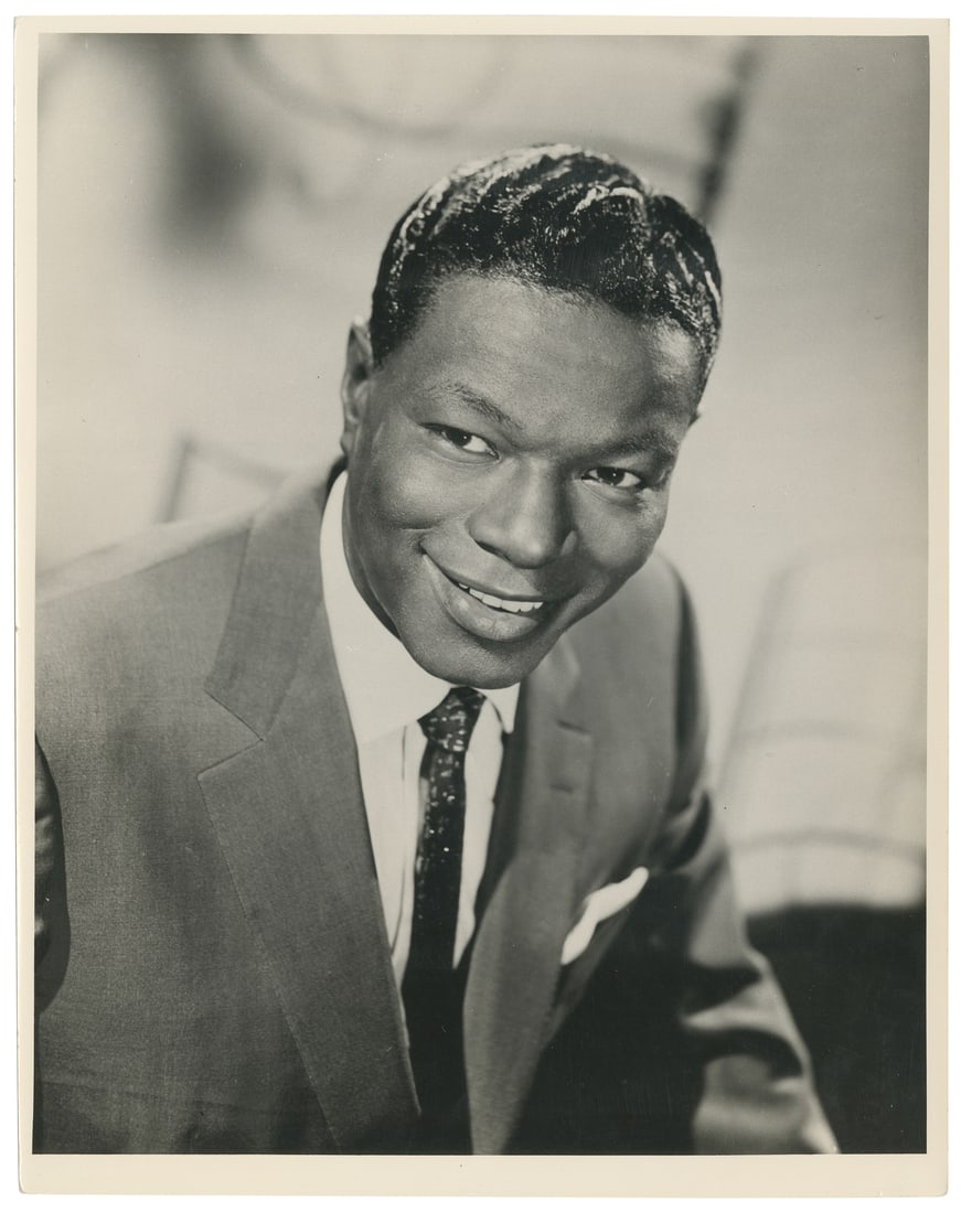 Two Photographs. Duke Ellington / Nat King Cole. Mid-20th century. : [JAZZ]. Two Photographs. Duke Ellington / Nat King Cole. Mid-20th century. Including an annotated and hand-painted press photograph of Duke Ellington and Louis Nye. CBS News, 1970. 7 x 9". [And] a hea