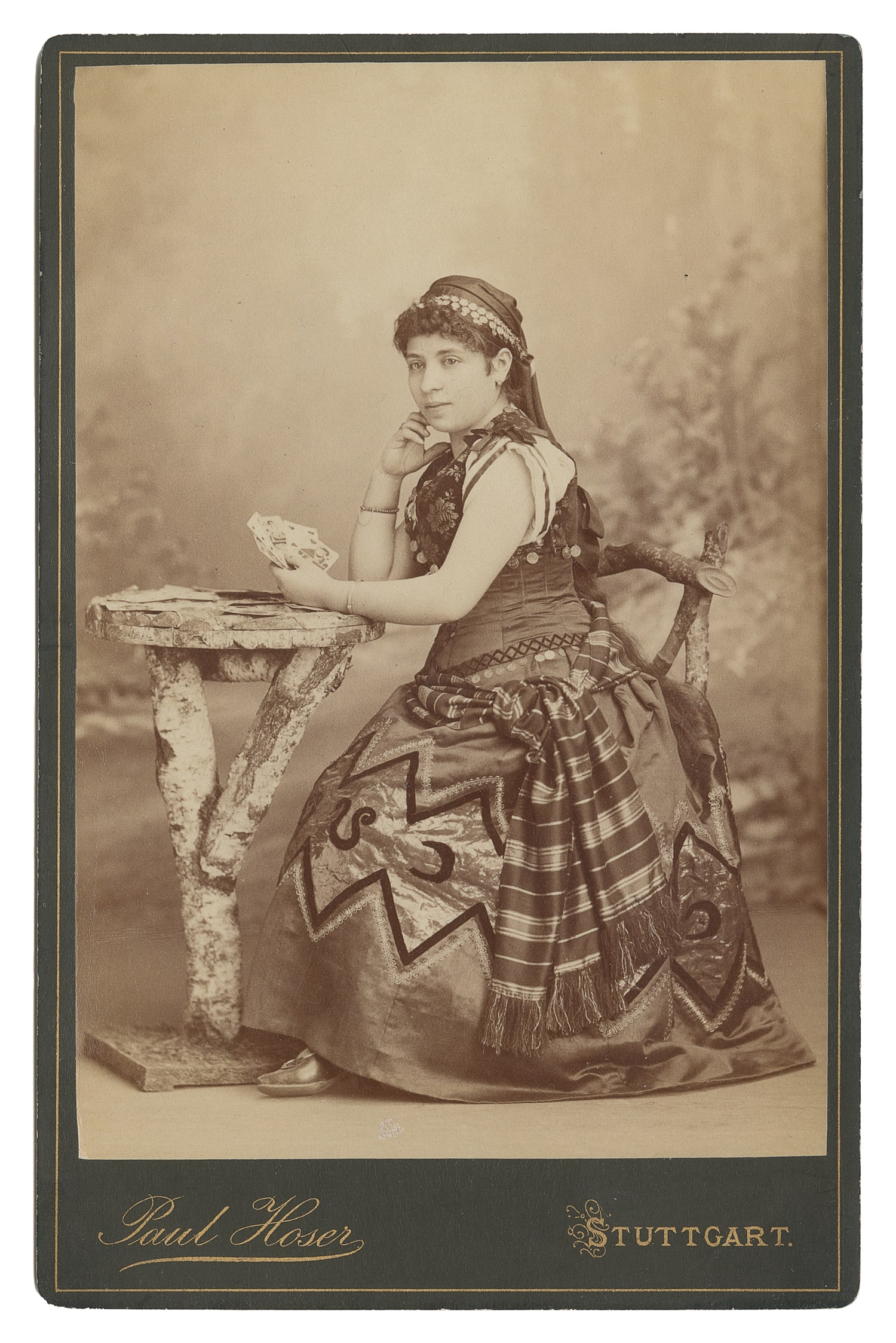 Cabinet photo of a woman with playing cards, possibly a fortune teller. (1 of 1)