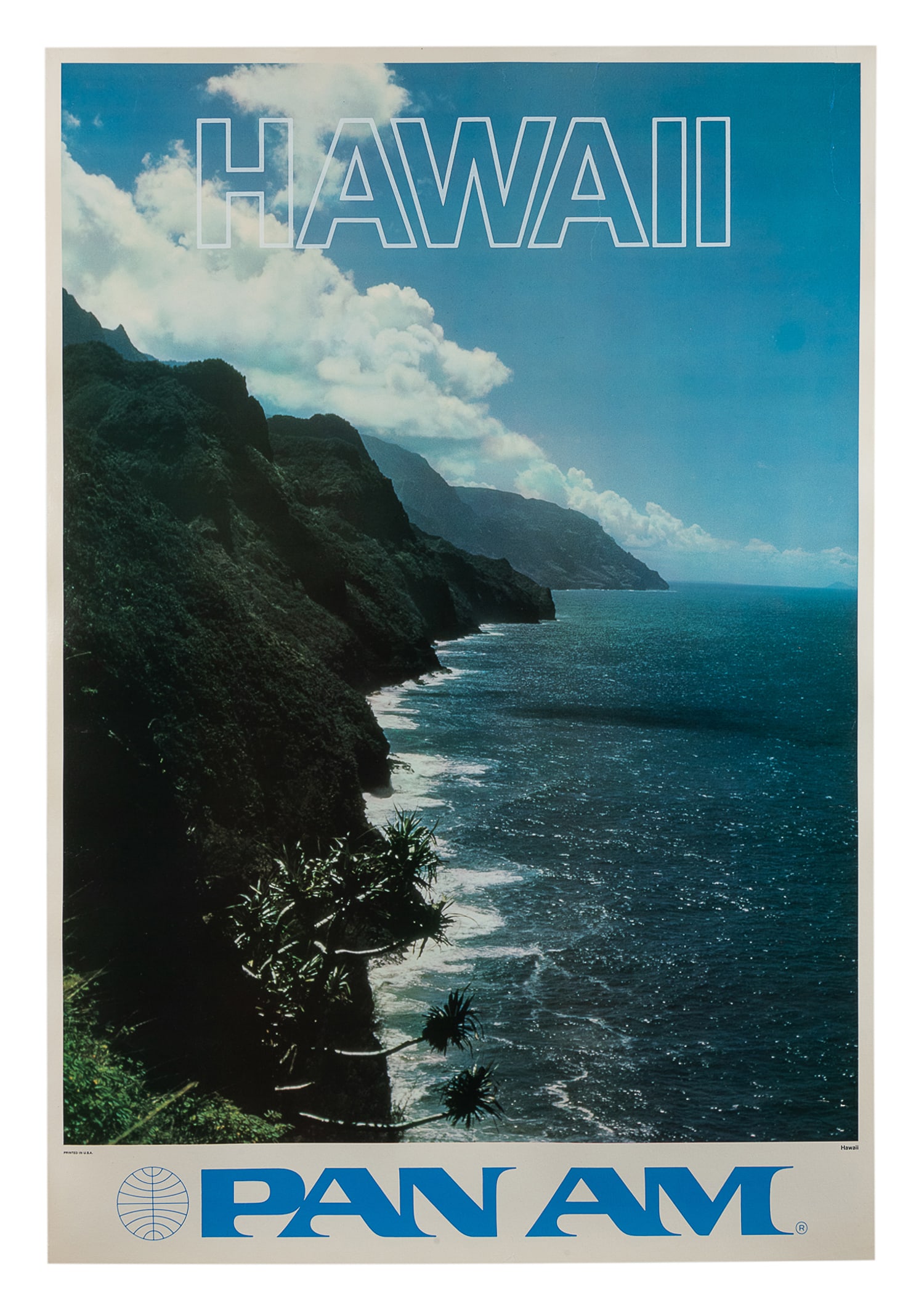 Hawaii / Pan Am. Circa 1970s.: Hawaii / Pan Am. Circa 1970s. Photographic airline poster with a beach scene showing the beautiful cliffside coastline. Linen backed. Scattered surface abrasions. 36 ½ x 25”. A-/A. 