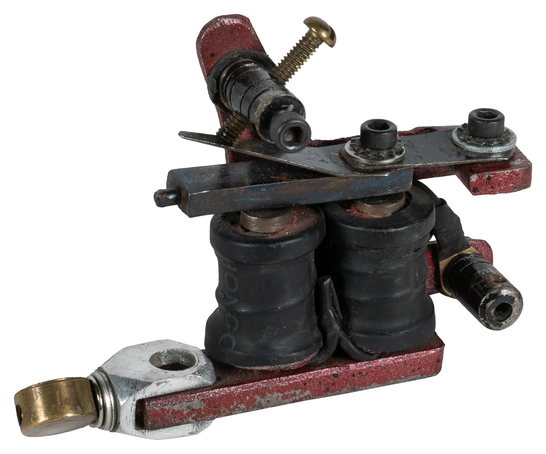 Jonathan Shaw's Fun City Tattoo Machine.: Jonathan Shaw's Fun City Tattoo machine. Circa 1990s. Coil tattoo machine owned and used by Shaw at his New York tattoo shop Fun City Tattoos. 4 x 3 1/2 x 1". Provenance: Collection of Jonathan Shaw.