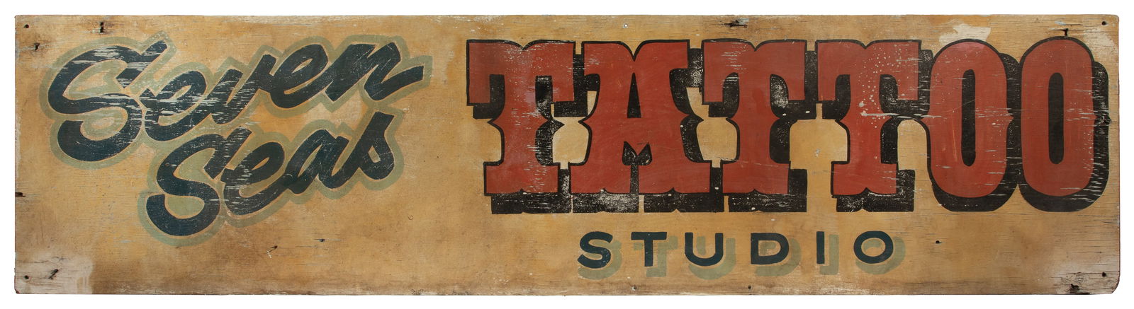 Hand Painted Sign for Seven Seas Tattoo Studio: The Pike, Long Beach, CA. With accompanying photograph . A historic sign from an important shop operating on the Pike in Long Beach. Some chipping of paint given age and exposure to elements, but good