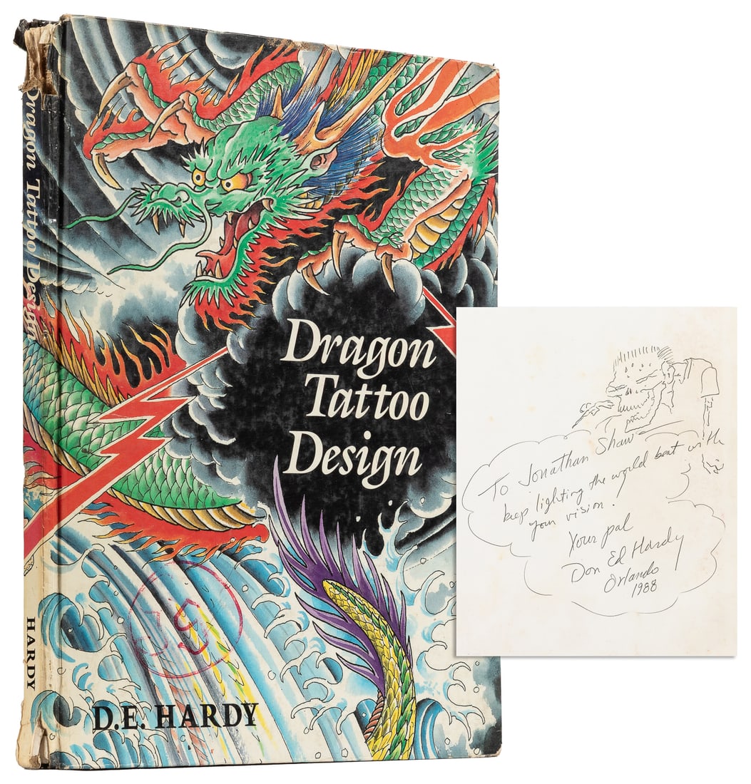 HARDY, Don Ed. Dragon Tattoo Design.: HARDY, Don Ed. Dragon Tattoo Design. Honolulu: Hardy Marks, 1988. Color hardcover (chipped at spine ends with loss at top). Warmly inscribed by Hardy with a small sketch in ink on the front fly. Illus