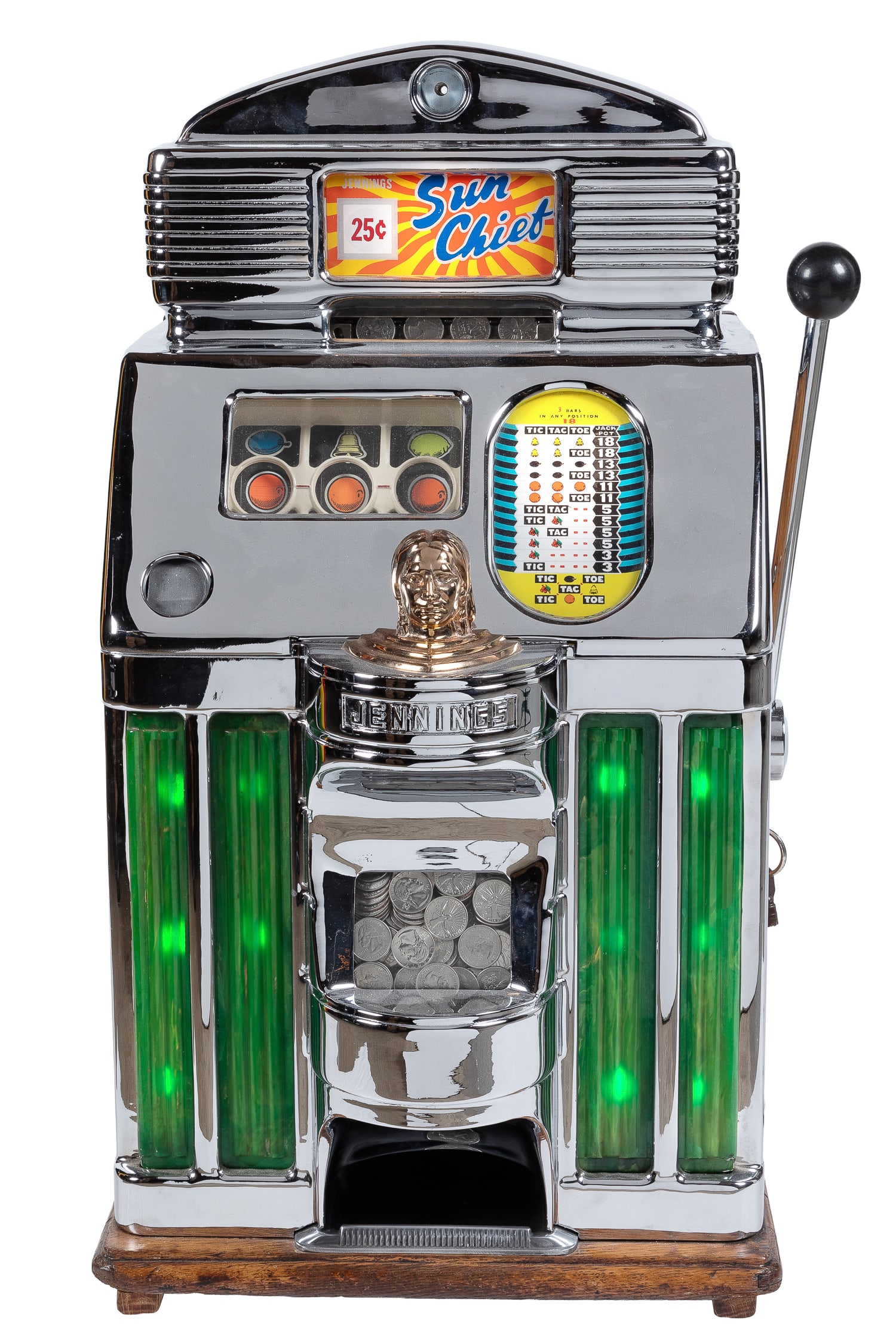 Jennings 25 Cent Sun Chief Light Up Slot Machine. Chicago: O.D. Jennings & Company, ca. 1950s.: Jennings 25 Cent Sun Chief Light Up Slot Machine. Chicago: O.D. Jennings & Company, ca. 1950s. Wooden case with aluminum front casting, two windows and name plate. With original back door, keys, and c