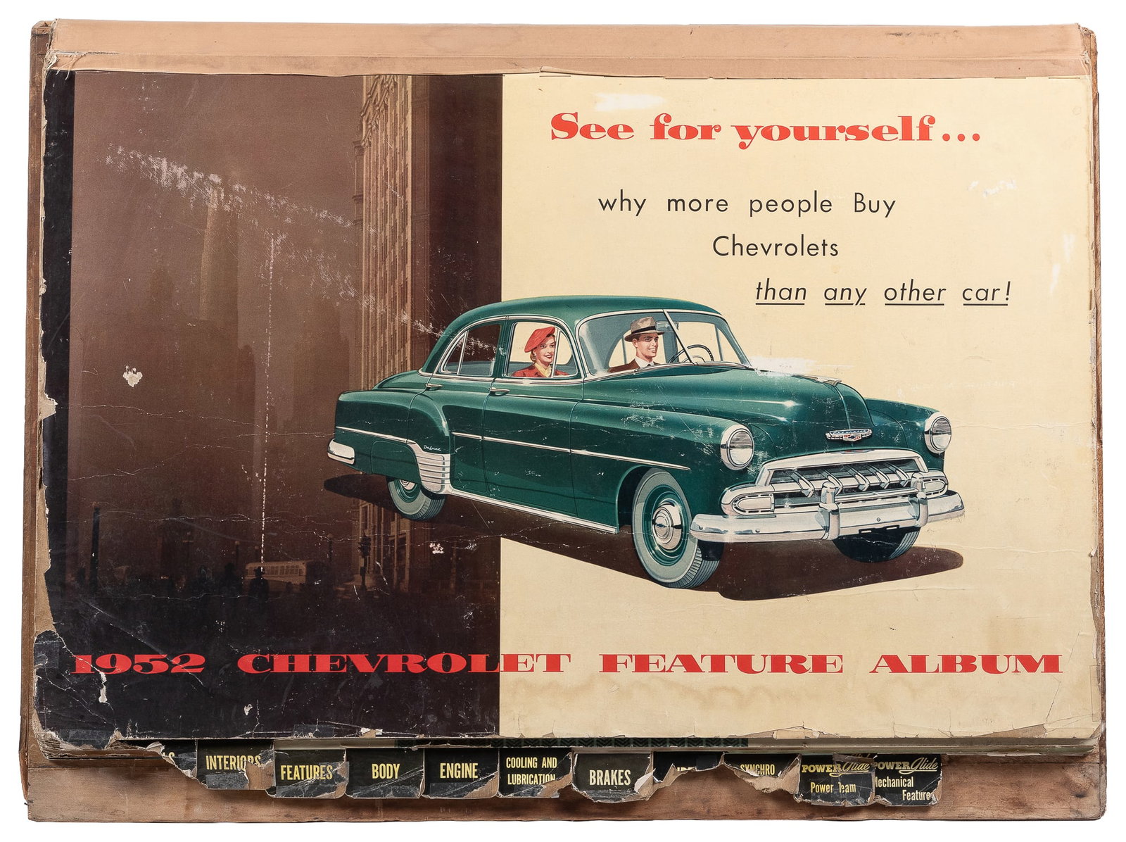 1952 Chevrolet Feature Album showroom display.: 1952 Chevrolet Feature Album showroom display. Showroom flipbook with 12 informational, illustrated panels on 1952 Chevrolets. On a triangle wooden base, as issued. 23 x 32 x 16".