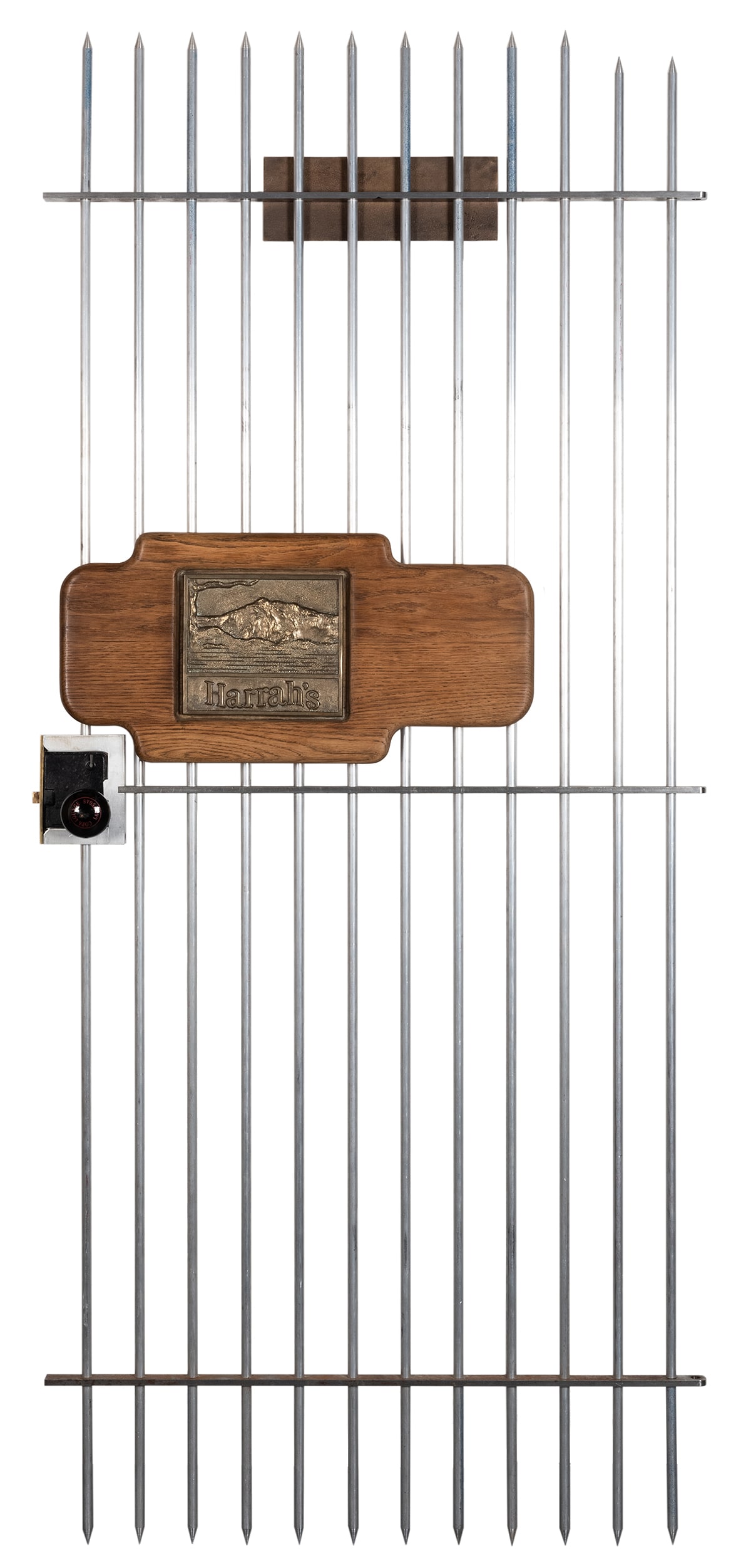 Vintage Casino Signs on Cage Door.: Vintage Casino Signs on Cage Door. Faux security cage door which incorporates a vintage Harrah's wooden sign; a cast metal Nevada age requirement sign for gaming establishments; and Copa Lounge