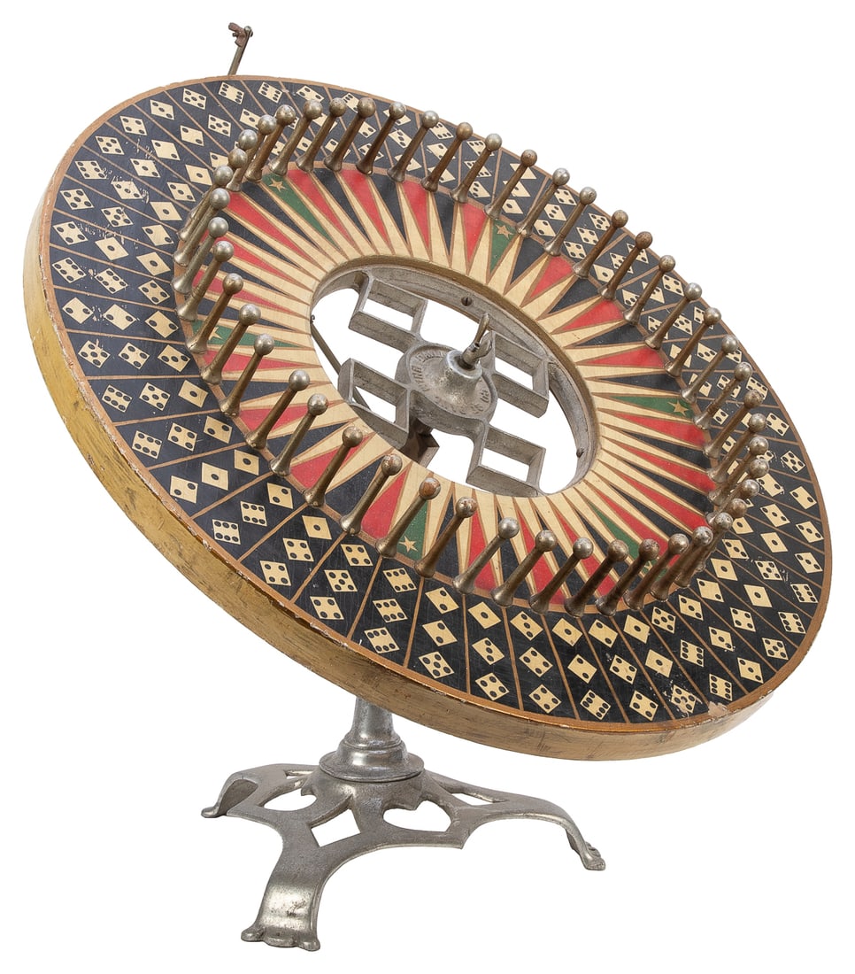 Dailey Mfg. Countertop Gaming Wheel on Original Stand. St....: Dailey Mfg. Countertop Gaming Wheel on Original Stand. St. Paul, MN: Dailey Mfg. Co., ca. 1920s-1930s. Painted wooden wheel with numbered dice, aluminum pins, original adjustable aluminum stand. 24"