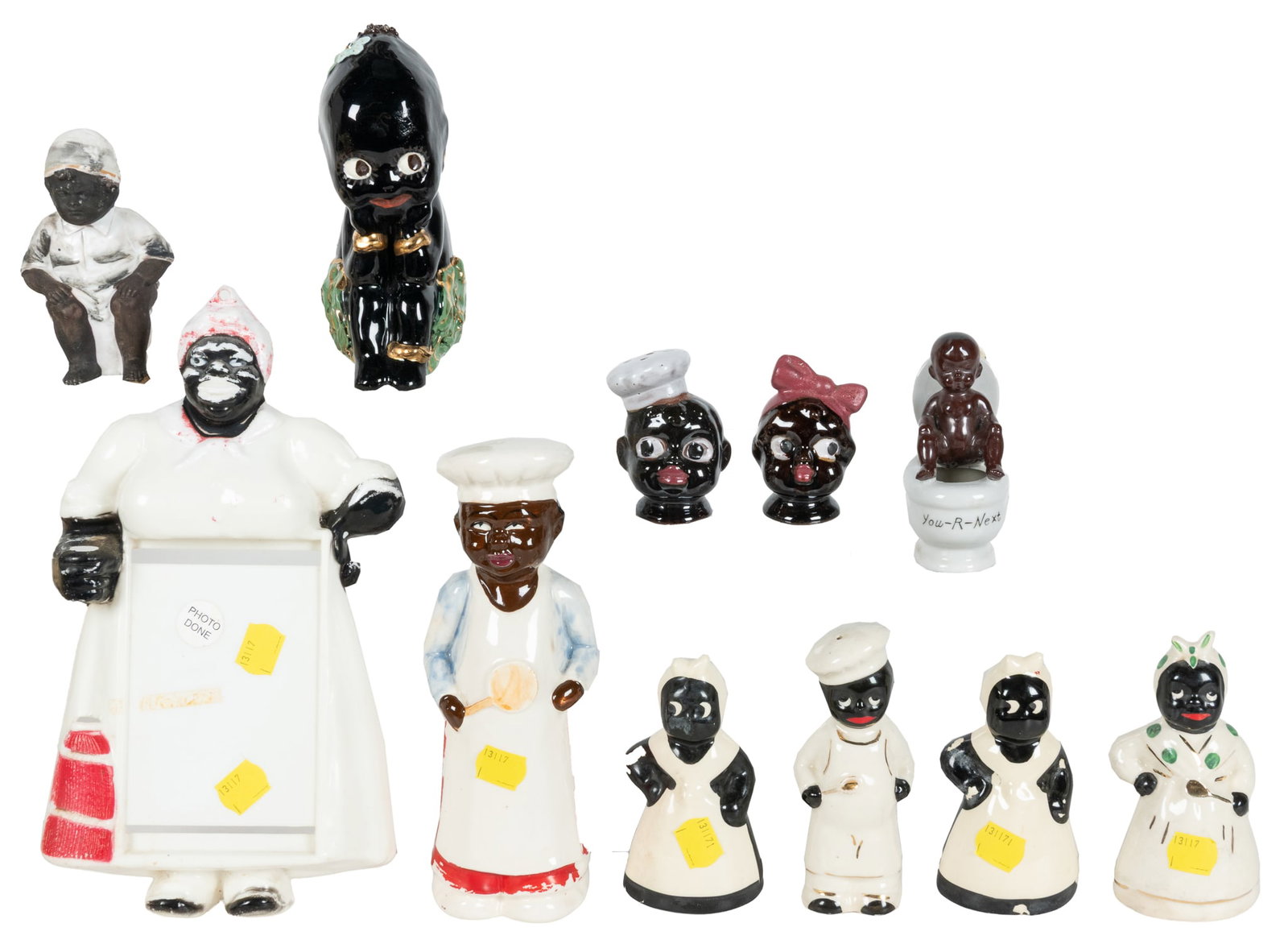 Group of Black Americana figures.: Group of Black Americana figures. Mid-20th century. Twenty pieces total, including salt and pepper sets, figurines, a tray, and more. Some marked "Japan," others unmarked. Photo shows portion of lot