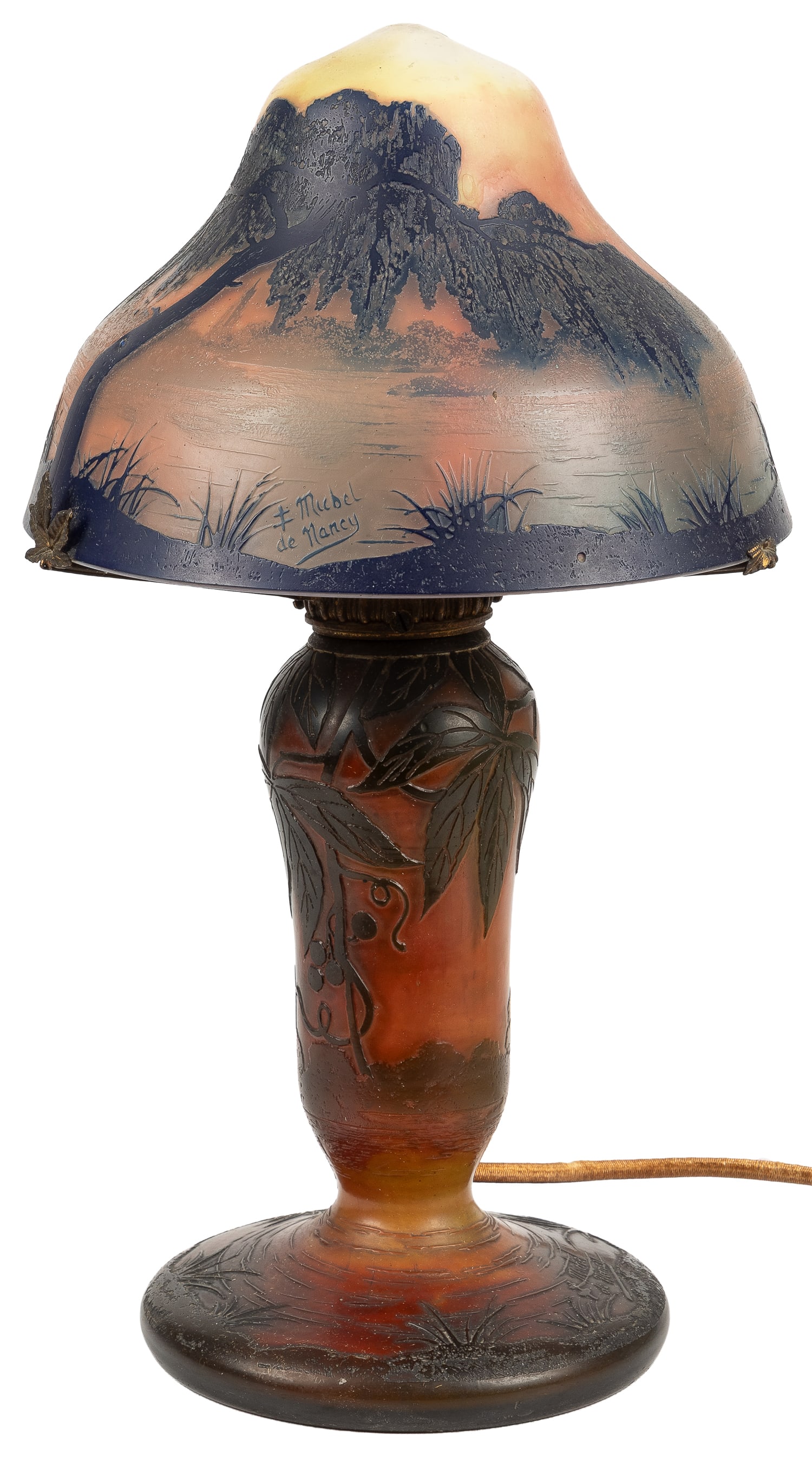 French Cameo Glass Table Lamp. Circa early 20th century.: French Cameo Glass Table Lamp. Circa early 20th century. Signed Michel de Nancy with the Cross of Lorraine. Art Nouveau lamp with a waterscape and foliage designs in earth tones. Brass hardware with