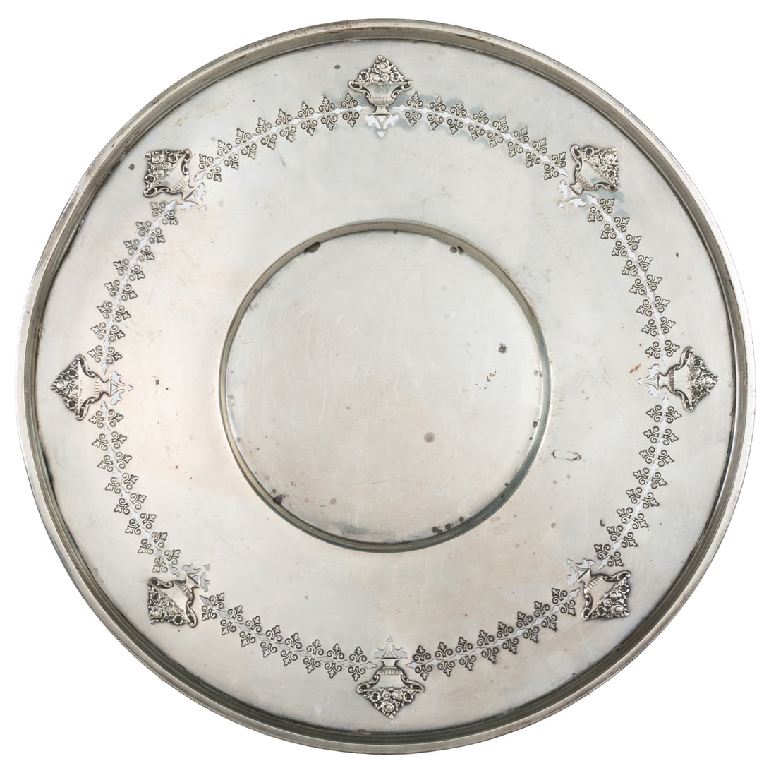 R. Wallace & Sons pierced sterling silver plate.: R. Wallace & Sons pierced sterling silver plate. Marked underside "R W & B / Sterling / 2845-3" and "Wallce" on opposite edge. Pierced shallow plate with embossed floral urns around border. Diameter
