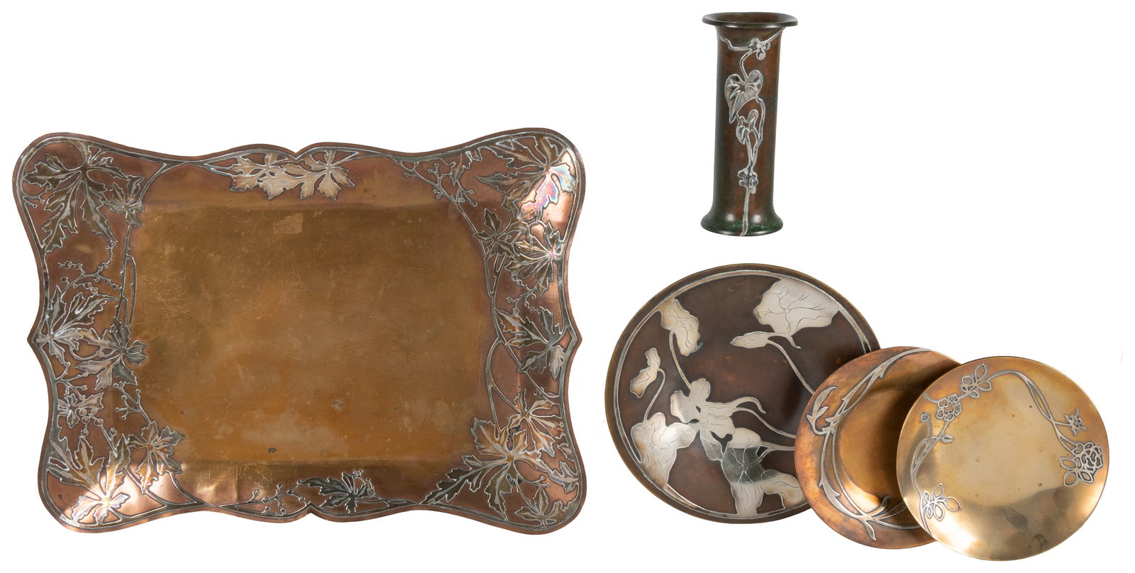 Art Nouveau silver on bronze group (5).: Art Nouveau silver on bronze group (5). American, early 20th century. Five pieces with organic / botanical silver designs on bronze, including three plates, a tray, and vase (possibly by Heintz;