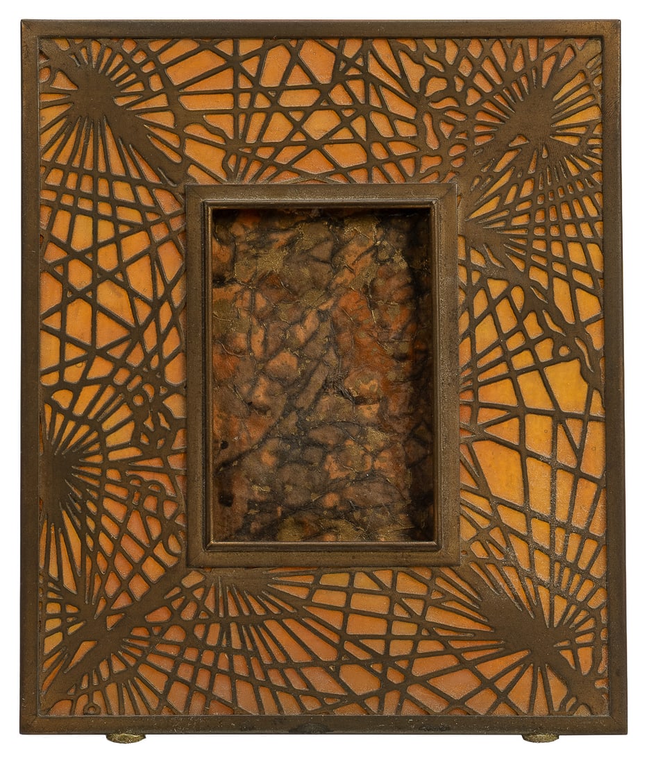 Tiffany Studios Pine Needle gilt bronze and glass frame.: Tiffany Studios Pine Needle gilt bronze and glass frame. New York: Tiffany Studios, early 20th century. Brass with inset glass panels, marked on reverse "Tiffany Studio / New York / 948." 7 1/4 x 6".