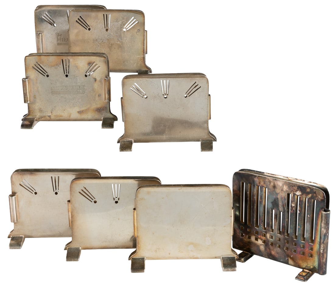 Group of 13 railroad menu holders.: Group of 13 railroad menu holders. A dozen silver soldered menu holders, marked by International Silver Co. and (1) Reiffel & Husted, including: (8) C.M. St. P & P.R.R. (2) The Milwaukee Road (1)