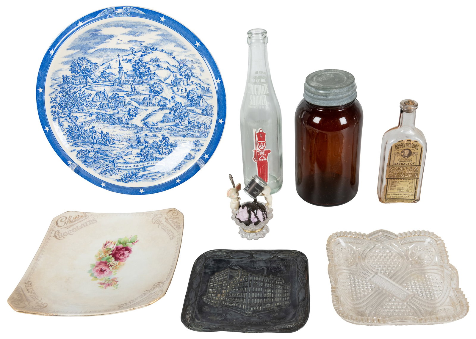 Seven chocolate and cocoa advertising bottles, trays, and plates. (1 of 1)