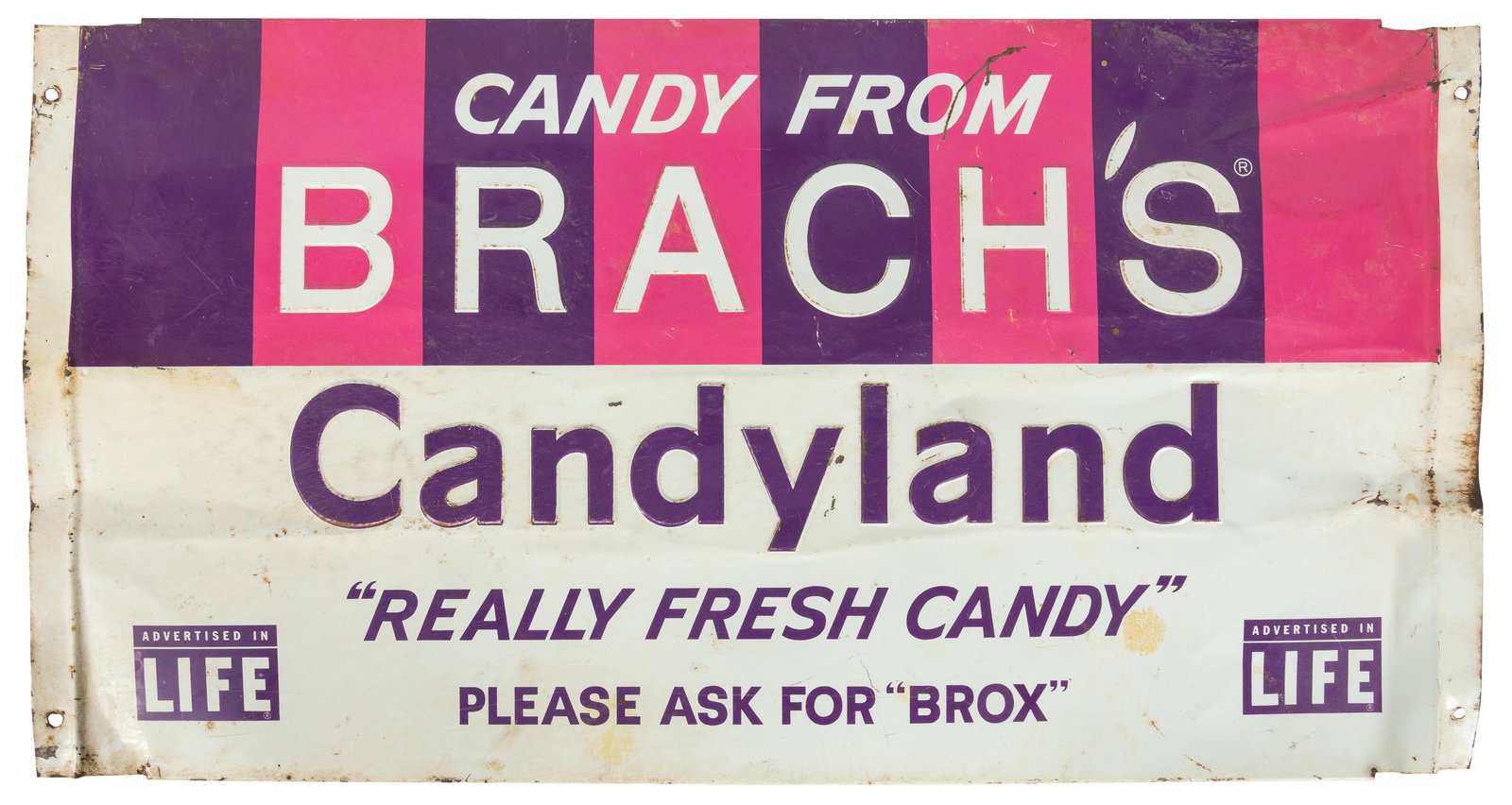 Brach's Candy metal sign.: Brach's Candy metal sign. Circa 1950s. Single-sided tin sign in pink and purple for Brach's, "as advertised in Life" (magazine). 14 x 26 3/4".