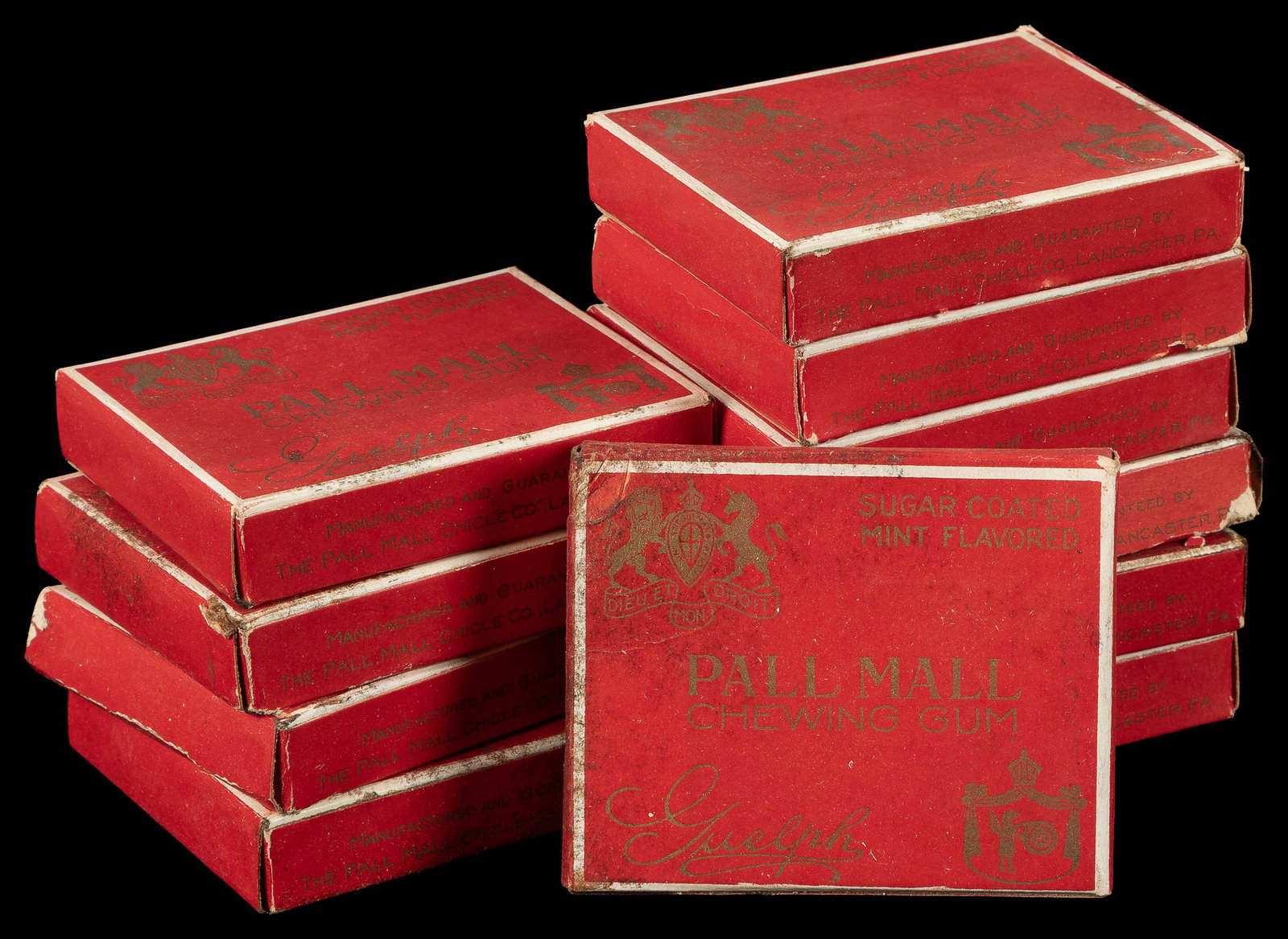Pall Mall Chewing Gum lot with partial box lid and sign.: Pall Mall Chewing Gum lot with partial box lid and sign. Lancaster, CA: The Pall Mall Chicle Co, ca. 1920s. Eleven boxes of chewing gum advertised at 5 cents each on the box, together with an incomple