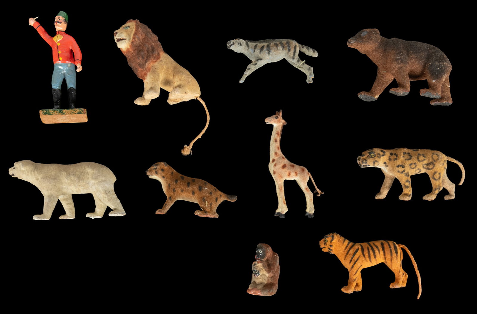 Antique circus / menagerie toy figure set.: Antique circus / menagerie toy figure set. Circa late 19th/early 20th century. Ten pieces, including painted wooden trainer/performer figure, and nine animals with flocked and painted bodies. In a