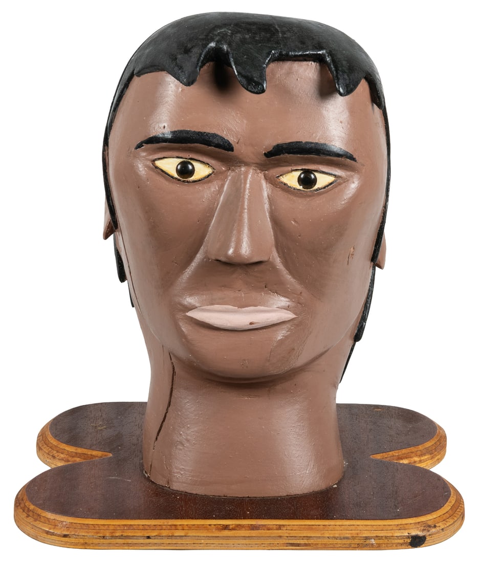 PENNEY, Roy Roosevelt (Canadian, circa 1933-1985). Wooden Head.: PENNEY, Roy Roosevelt (Canadian, circa 1933-1985). Wooden Head. Carved and hand-painted wood. Signed and inscribed on underside of base. 13 1/2 x 12 x 8 1/2".