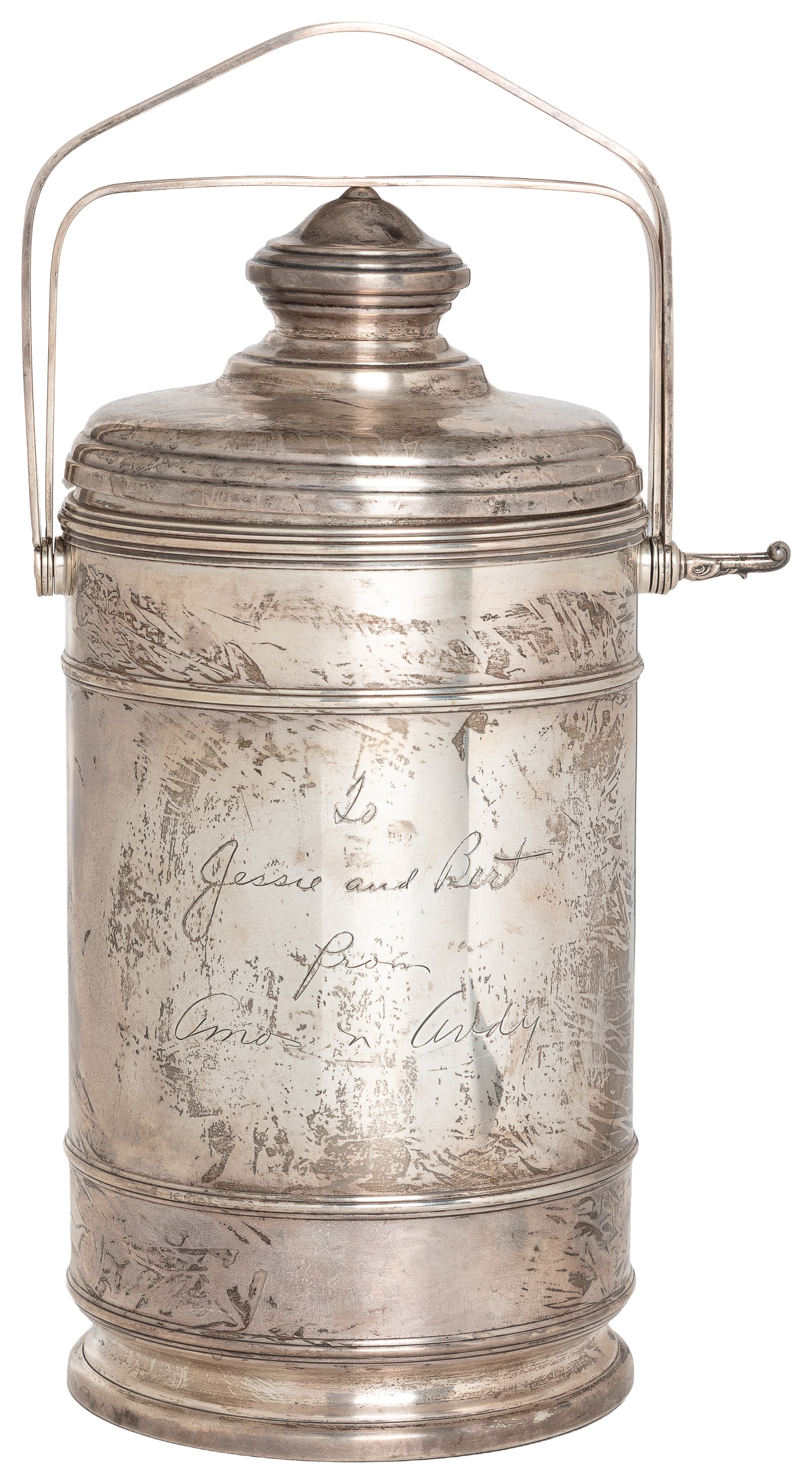 [KALMAR, Bert; association]. Cartier Sterling Silver Wine Bottle Ice Canister.: [KALMAR, Bert; association]. Cartier Sterling Silver Wine Bottle Ice Canister. Inscribed: "To Jess and Bert from Amos n' Andy." Circa 1935.13 1/2 x & 7 1/2 x 5 1/2" diameter.Marked underneath,