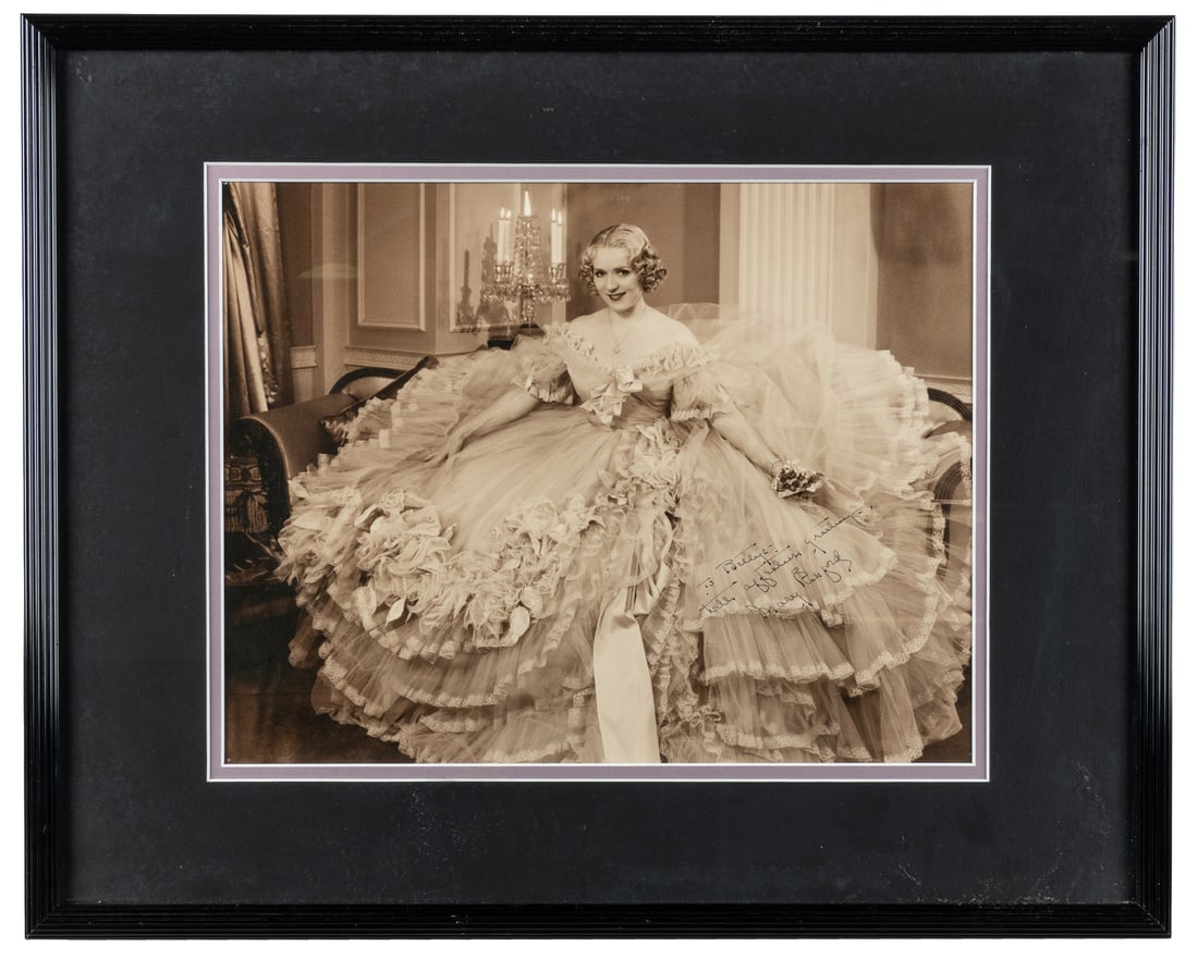 [PICKFORD, Mary (1892-1979)]. Signed publicity still.: [PICKFORD, Mary (1892-1979)]. Signed publicity still. Black-and-white photograph depicts a seated Mary Pickford as Mary Marlowe Carlton in "Secrets," which would ultimately be her final film role.