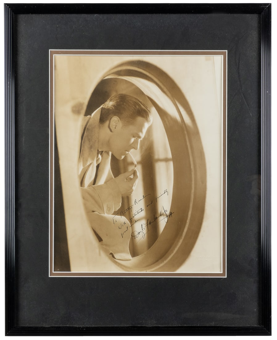 [FAIRBANKS, Douglas Jr. (1909-2000)]. Signed and Inscribed Portrait Photograph.: [FAIRBANKS, Douglas Jr. (1909-2000)]. Signed and Inscribed Portrait Photograph. Inscribed "To Bettye R—, With gratitude and friendly good wishes." Bears embossed chop mark of Elmer Fryer, head