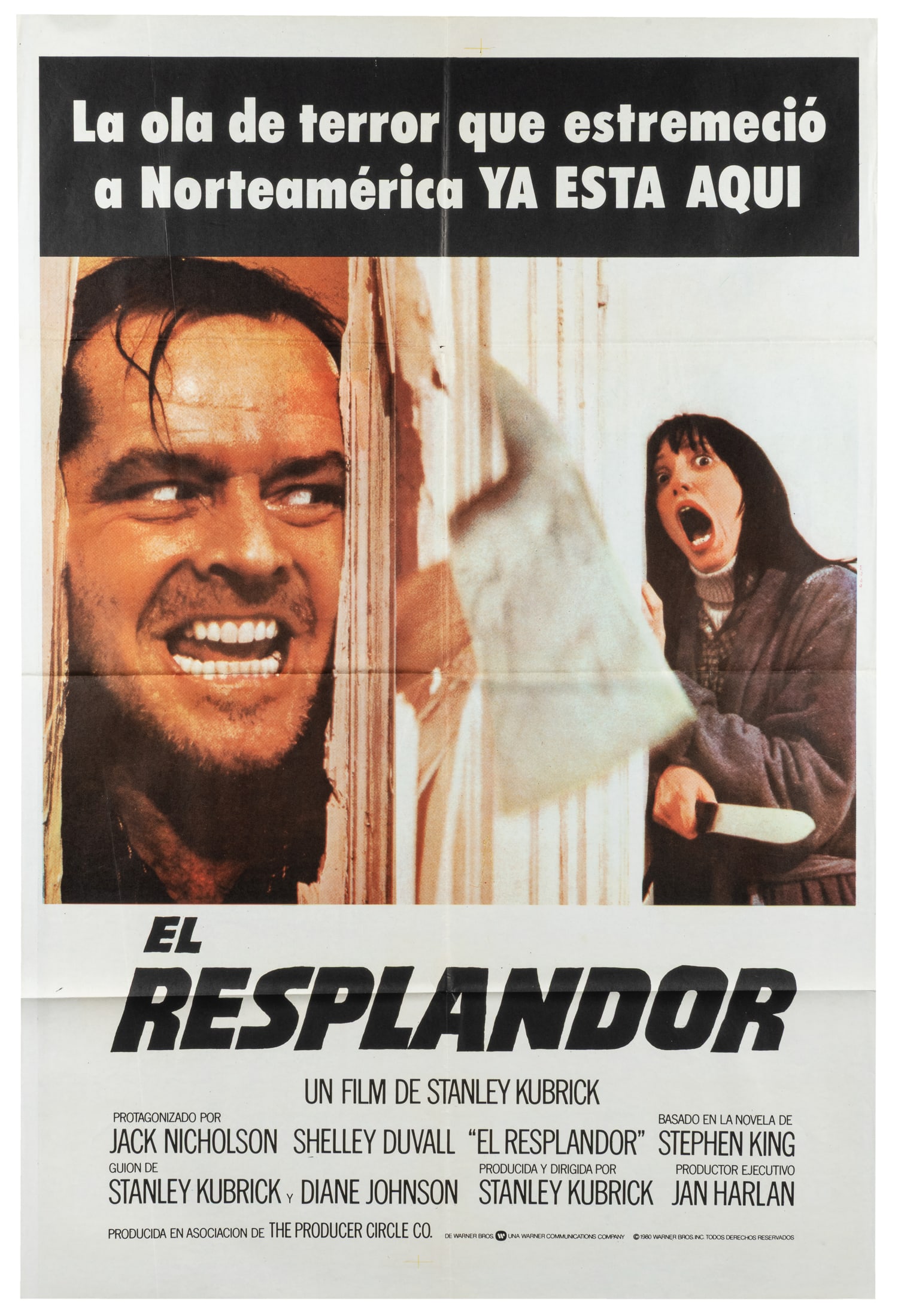 The Shining. Warner Bros., 1980.: The Shining. Warner Bros., 1980. Spanish language one-sheet (27 x 39 1/2") poster for the iconic psychological horror film starring Jack Nicholson, Shelley Duvall, Danny Lloyd, and Scatman Crothers.