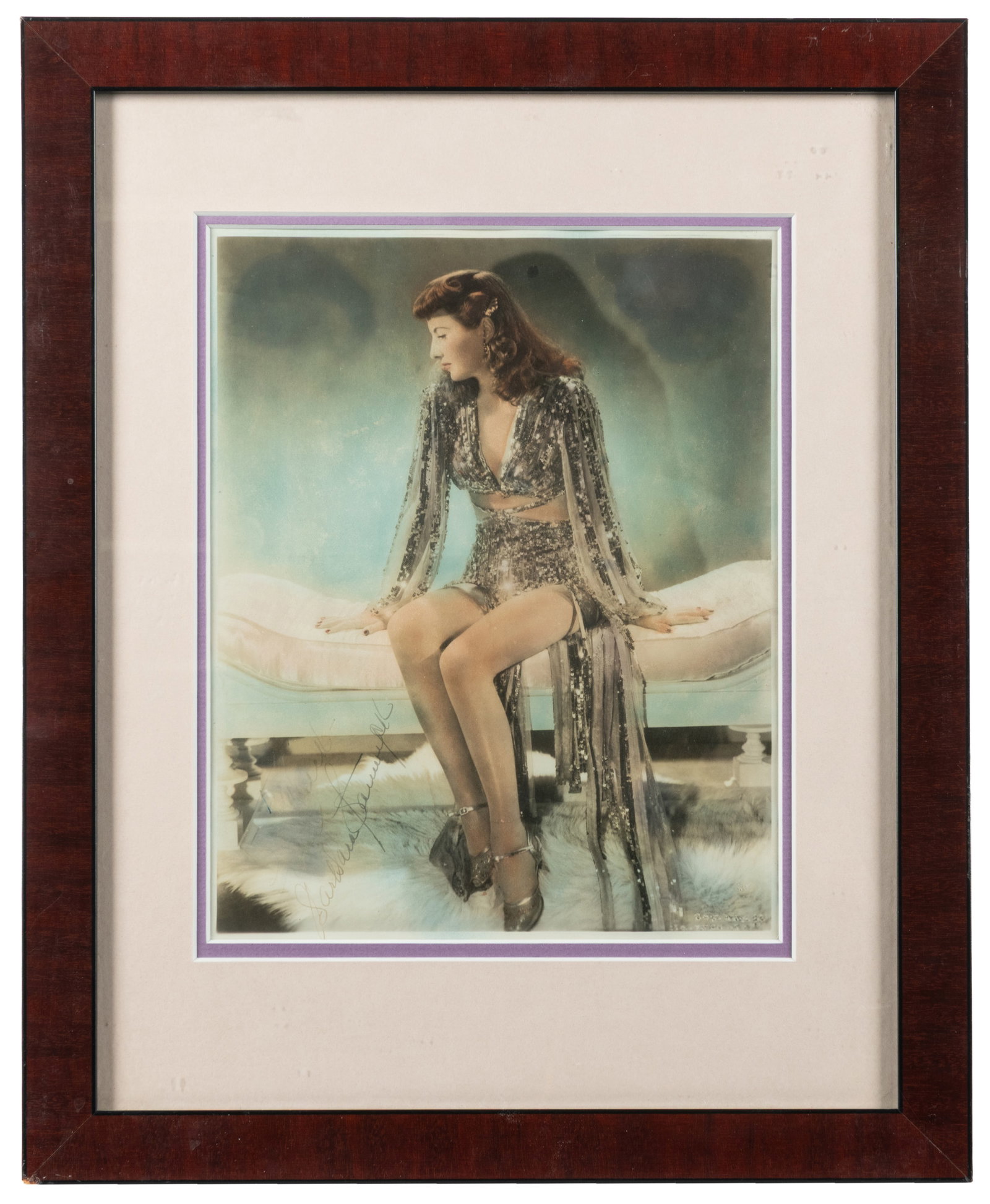 [STANWYCK, Barbara (1907-1990)]. Signed Tinted Publicity Still of Barbara Stanwyck. Circa 1940s. (1 of 2)