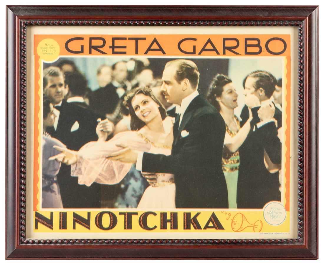 Ninotchka. MGM, 1939.: Ninotchka Hollywood: Metro Goldwyn-Mayer,1939. Color lobby card, captioned "Let us dance! Everything is so wonderful!". Sight approximately 10 3/4 x 13 1/2". Framed under glass. Frame size