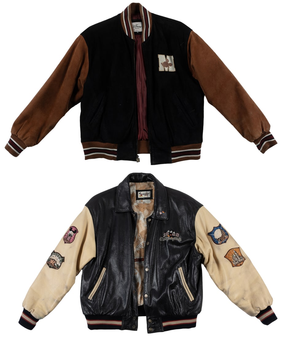 Two Disney leather and suede jackets.: Two Disney leather and suede jackets. Including:Walt Disney World 2000 Millennium Celebration leather jacket, size large.Disney Store suede leather varsity jacket, size medium.