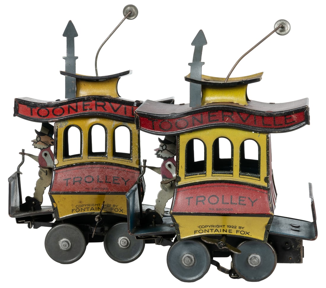 Fontaine Fox Toonerville Trolley tin toys (2).: Fontaine Fox Toonerville Trolley tin toys (2). 1920s. Tin lithograph wind-up trolley toys.7 1/2 x 2 1/2 x 5".