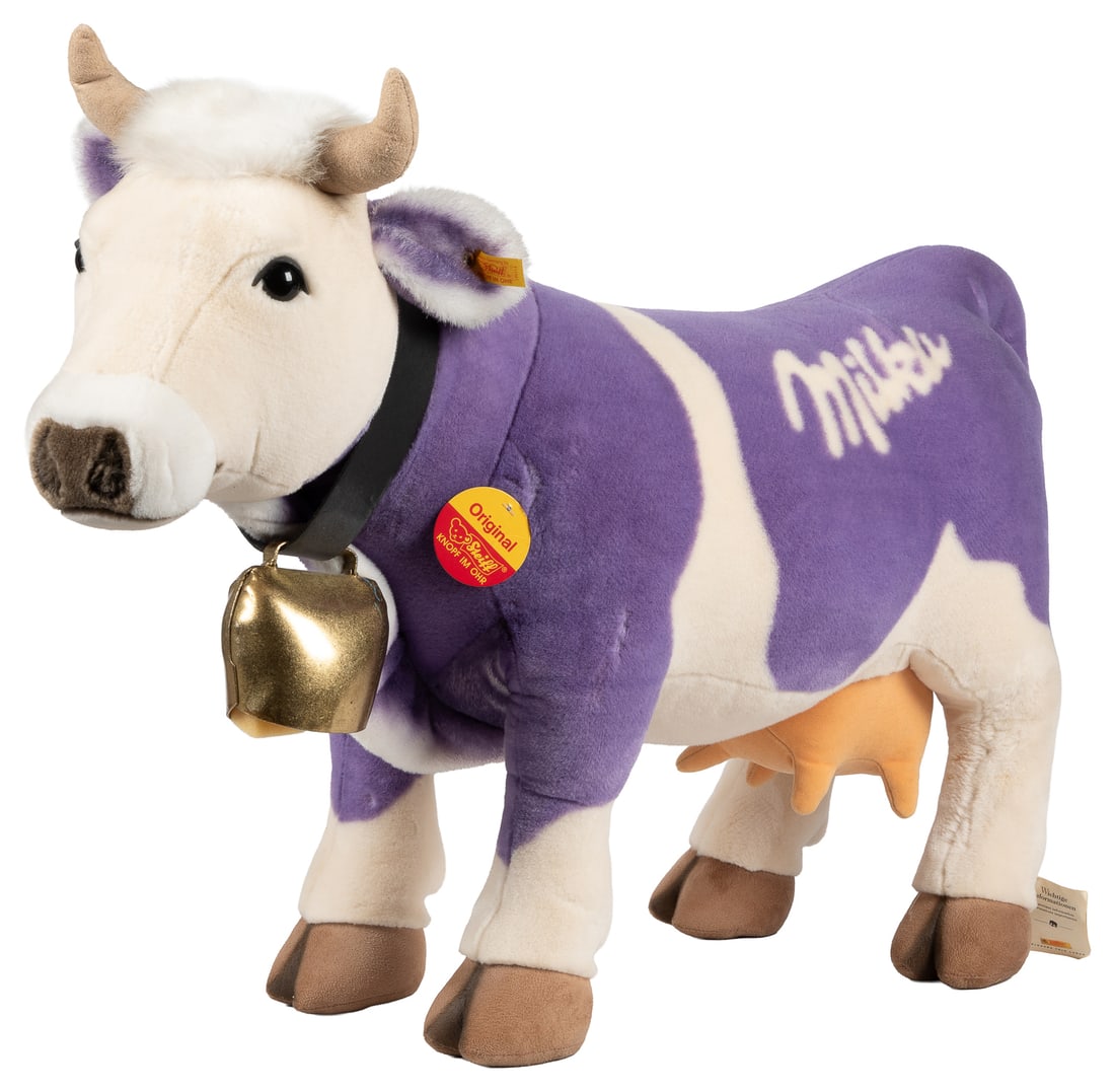 Steiff Milka Cow.: Steiff Milka Cow. Circa 1997. EAN 998546. Purple and white cow with cowbell, chest tag, and leg tags.28 x 19 x 8".