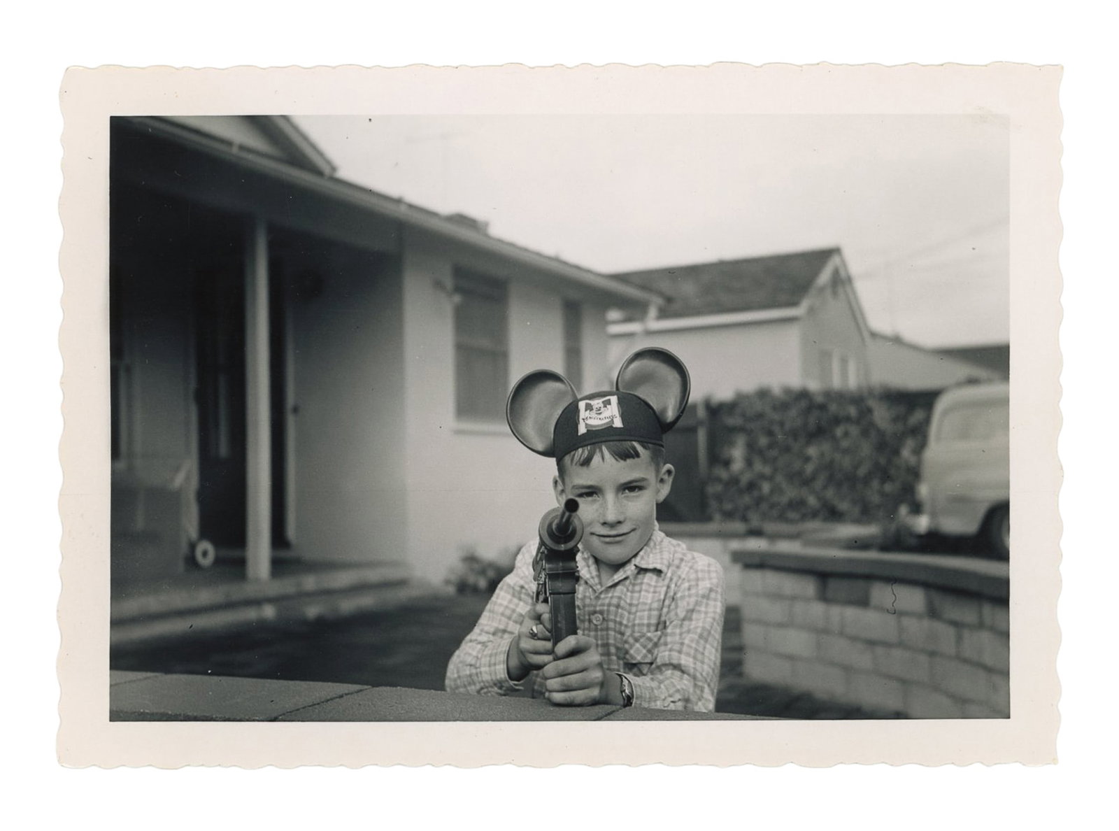 Snapshot of Kid with Mouseketeers Hat Holding Toy Machine Gun. (1 of 1)
