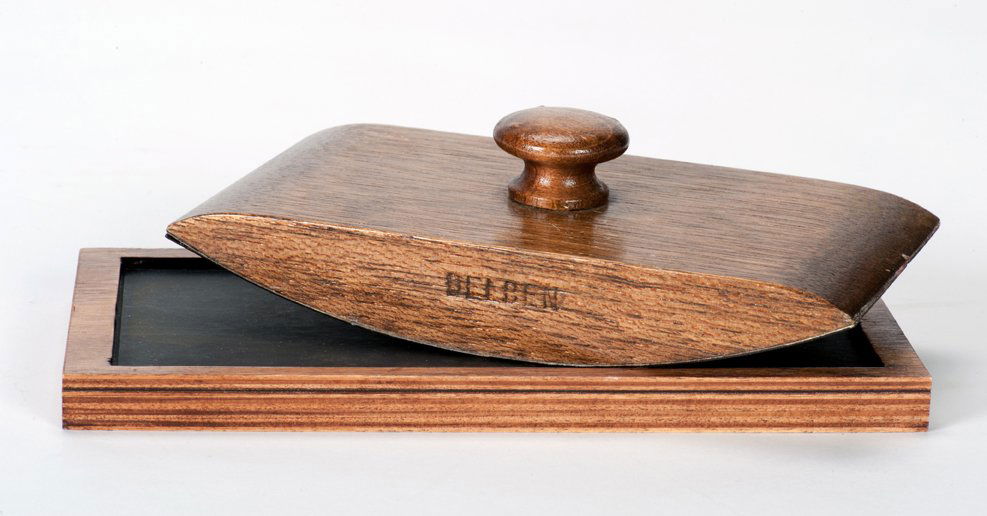Delben Blotter. Ben Stone, ca. 1980: Delben Blotter. Ben Stone, ca. 1980. A wooden blotter that visibly transforms a blank slip of paper into a real dollar bill. Hallmarked. With instructions and resetting device. Good condition.