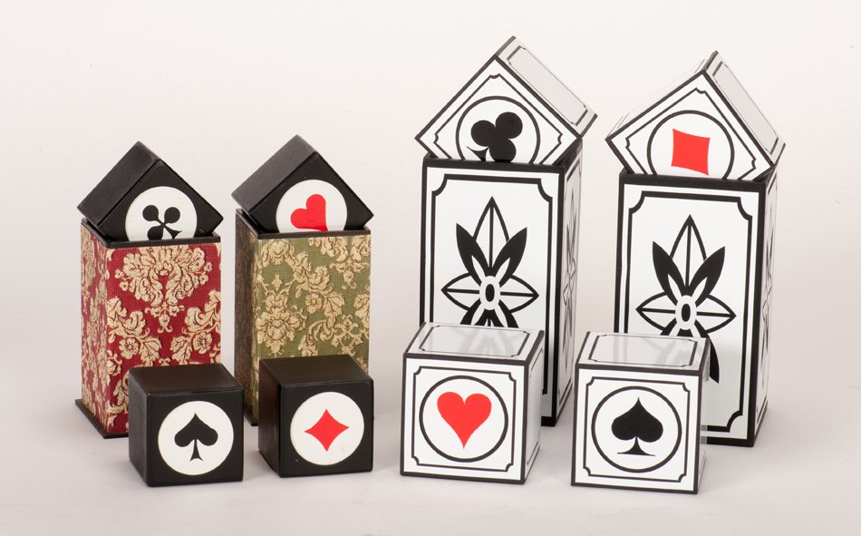 Card/Block Transpositions.: Card/Block Transpositions. Playing card pips on four blocks transpose under two covers. Two versions of the same effect included, one by Tony Lackner, the other constructed by Eckhard Boettcher. Both 