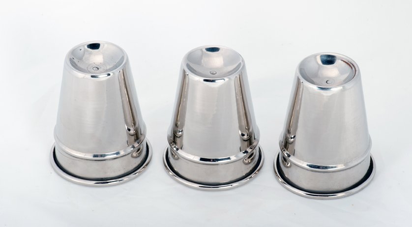 Cups and Balls. Sherms Inc., ca. 1940: Cups and Balls. Bridgeport Connecticut, Sherms Inc., ca. 1940. Set of three spun, nickel plated cups of traditional design for the classic sleight-of-hand trick. Cups stand 3 1/8” high, with mouths 