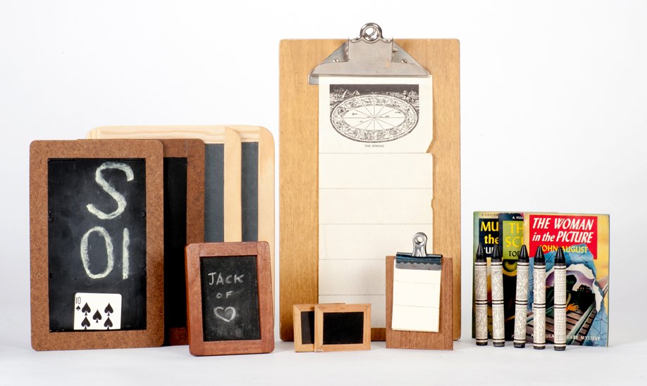 Group of vintage mentalism-themed magic props: [Mentalism] Group of vintage mentalism-themed magic props. Including various gimmicked slates for predictions (including card effects, spirit slates, and miniature slates), an early Nelson Clipboard (