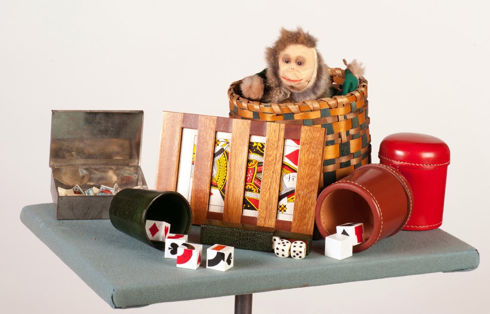 Group of vintage and contemporary magic props: [Miscellaneous] Group of miscellaneous vintage and contemporary magic props and accessories. Including dice cups and dice, wooden slat (Tarbell-style) card vanishing frame, Steen Magic Co. collapsible