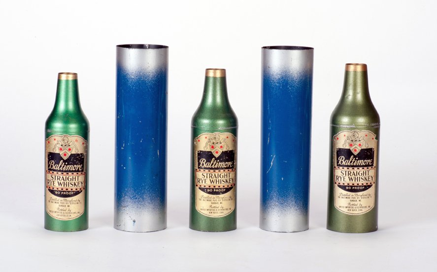 Passe Passe Bottles. Petrie & Lewis, ca. 1939: Passe Passe Bottles. New Haven, Petrie & Lewis, ca. 1939. A bottle and glass, each covered by a metal tube, continually change places by magic. Three nesting spun metal bottles and two tubes; smallest
