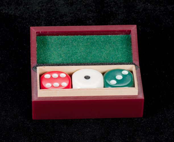 Uncanny Die. Eddy Taytelbaum, ca. 1970: Uncanny Die. Holland, Eddy Taytelbaum, ca. 1970. Three dice are seen in a small oblong box. One is removed and vanishes, only to reappear inside the closed box. 2 ¼ x 1 x 1”. Fine.