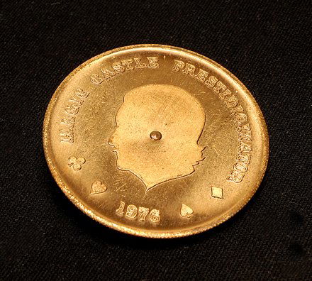 Magicians' Tokens and Medallions collection: [Tokens and Medallions] Collection of over 100 magicians’ tokens, palming coins, and wooden nickels. Including examples advertising Kassner, Owen Magic Supreme, The Magic Cauldron, The Magic Circle,