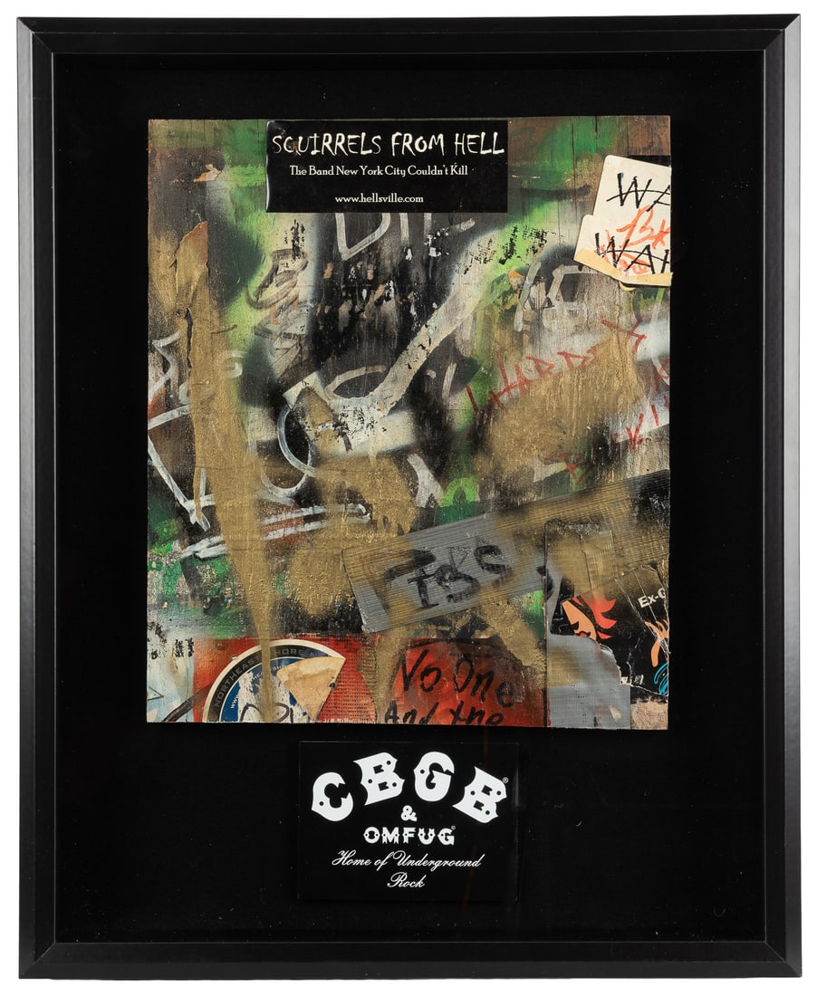 [CBGB & OMFUG CLUB]. Wall Piece from Interior of CBGB, Framed in Shadowbox. [Circa 1973-2000s].: [CBGB & OMFUG CLUB]. Wall Piece from Interior of CBGB, Framed in Shadowbox. [Circa 1973-2000s]. Neatly cut wooden wall segment with stickers, tape, and multi-colored paint, with a CBGB logo card. Wall