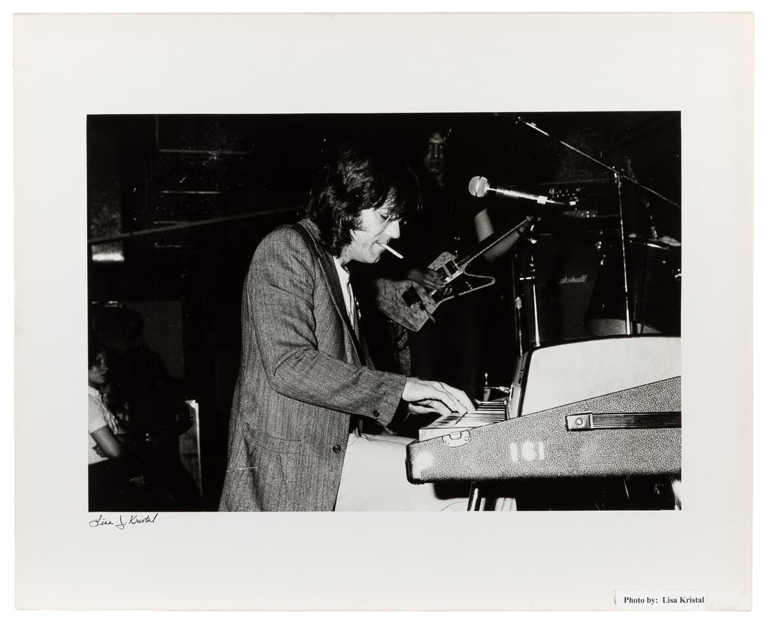 [KRISTAL, Lisa, photographer]. Photographic Portrait of Doors Keyboardist Ray Manzarek on Stage at: [KRISTAL, Lisa, photographer]. Photographic Portrait of Doors Keyboardist Ray Manzarek on Stage at CBGB. [Ca. 1977-2000s]. Large black and white photograph of Manzarek playing keyboards on stage at CB