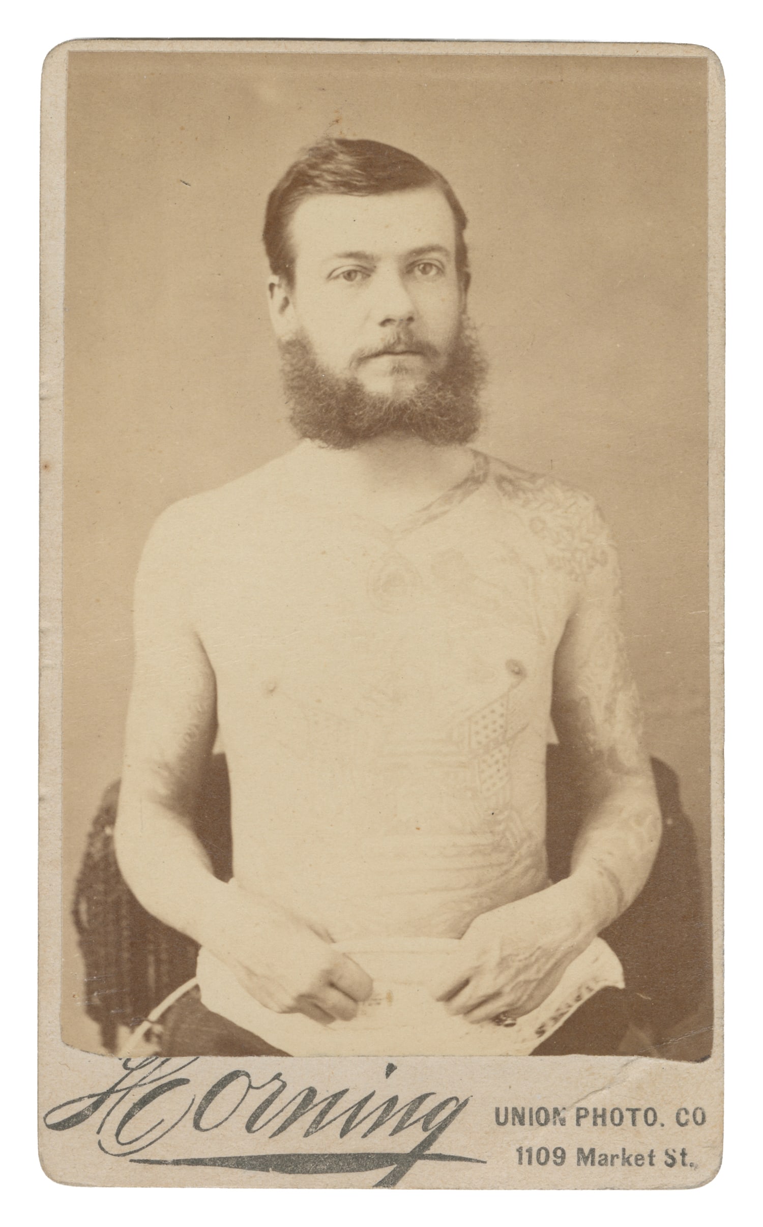 [TATTOO]. CDV of Capt. Harry Decoursey, Tattooed Man. Circa 1880s.: [TATTOO]. CDV of Capt. Harry Decoursey, Tattooed Man. New York: Charles Eisenmann, ca. 1880s. Albumen print on studio mount. 4 1/8 x 2 1/2". Decoursey’s tattoos were done by the well-known early