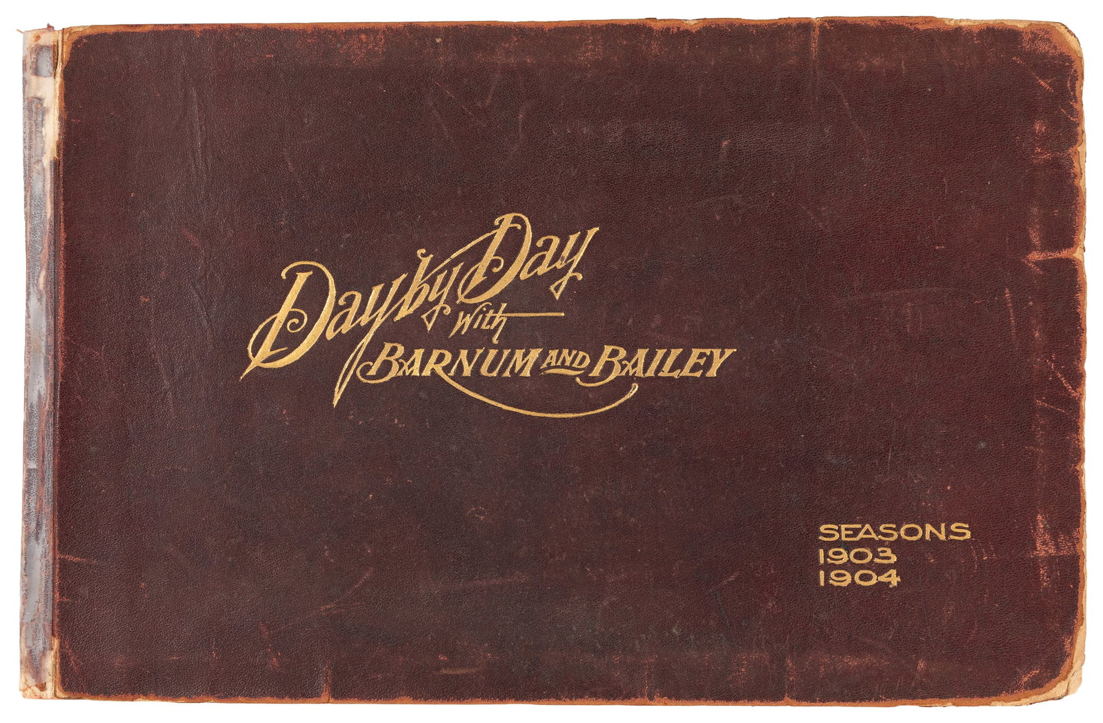 ANDRESS, Charles. Day by Day With Barnum & Bailey. Seasons 1903-1904.: ANDRESS, Charles. Day by Day With Barnum & Bailey. Seasons 1903-1904. [Buffalo: The Courier Company, 1903.]. Gilt-lettered soft leather. Numerous illustrations from photographs of circus acts includin