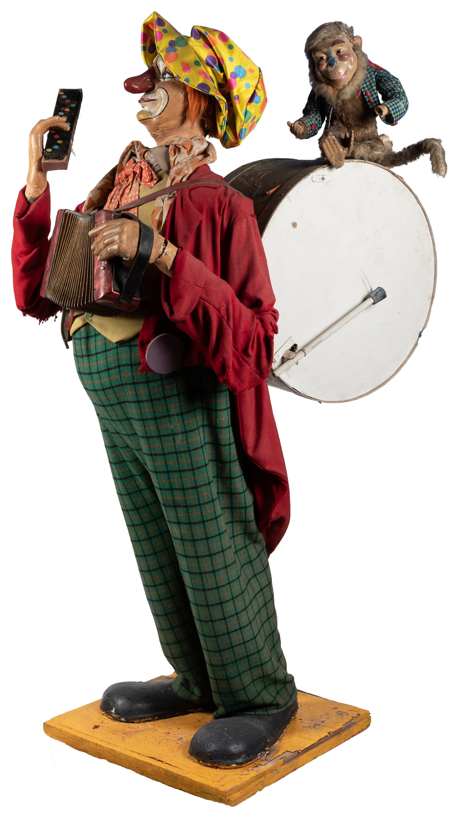 Clown and monkey animatronic figure.: Clown and monkey animatronic figure. Circa mid-20th century. A nearly life-size figure of a clown, holding an accordion and harmonica, with a drum and monkey carried on its back. Working electric
