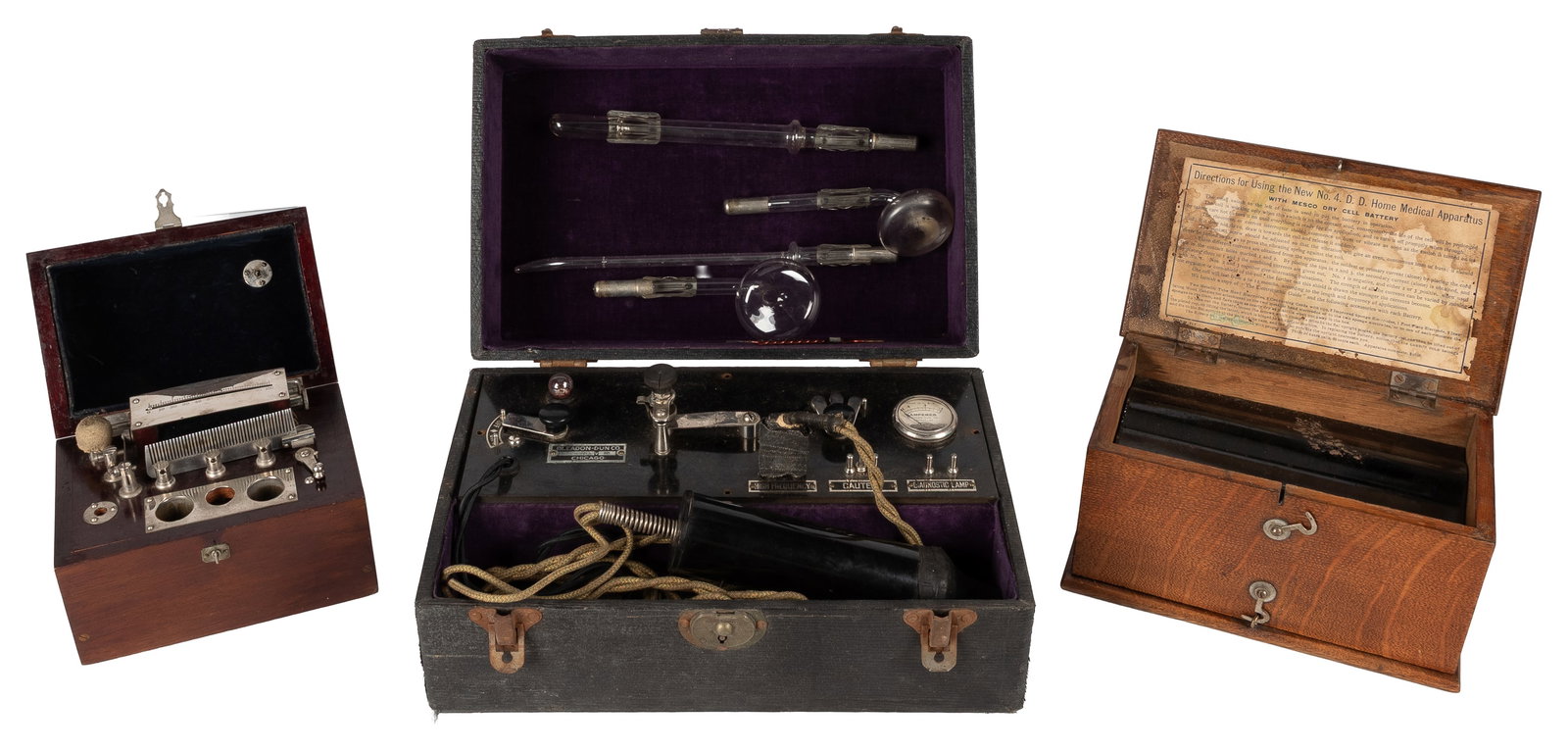 [QUACKERY]. Trio of Electro-Shock Therapy Apparatus, in Carrying Cases. [V.p., ca. 19th - 20th: [QUACKERY]. Trio of Electro-Shock Therapy Apparatus, in Carrying Cases. [V.p., ca. 19th - 20th centuries]. Including: No. 4 D. D. Home Medical Apparatus with Mesco Dry Cell Battery. Wooden case with