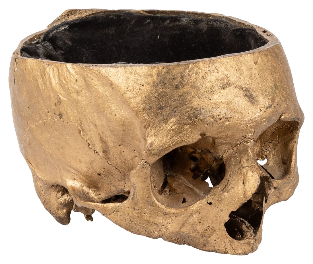 Human skull.: Human skull. A partial skull, painted gold, and lined with black velvet. 4 1/2 x 5 1/2 x 7".