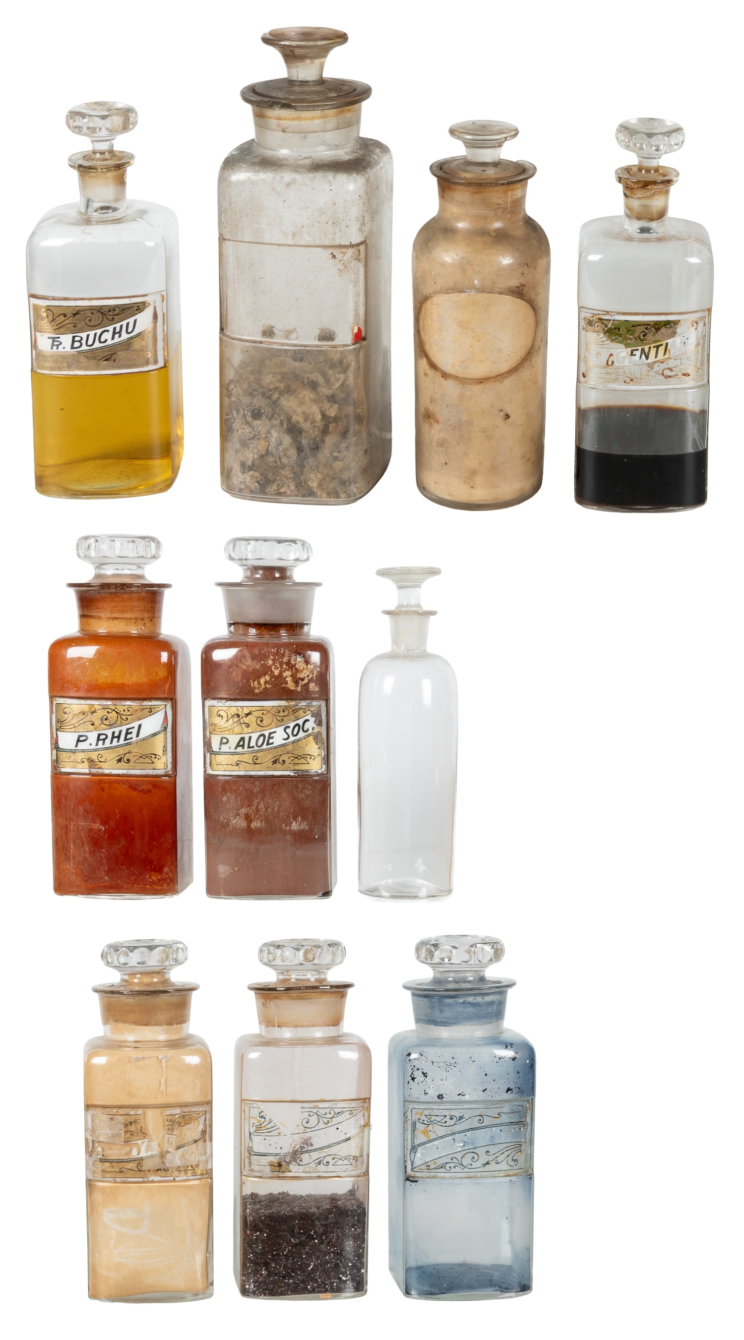 [APOTHECARY]. Group of 21 Glass or Ceramic Apothecary Jars, Several with Medicines. [N.p., ca. 19th: [APOTHECARY]. Group of 21 Glass or Ceramic Apothecary Jars, Several with Medicines. [N.p., ca. 19th - 20th centuries]. 18 glass (2 cobalt) jars with stoppers, 3 pottery jars (1 with lid). About 10