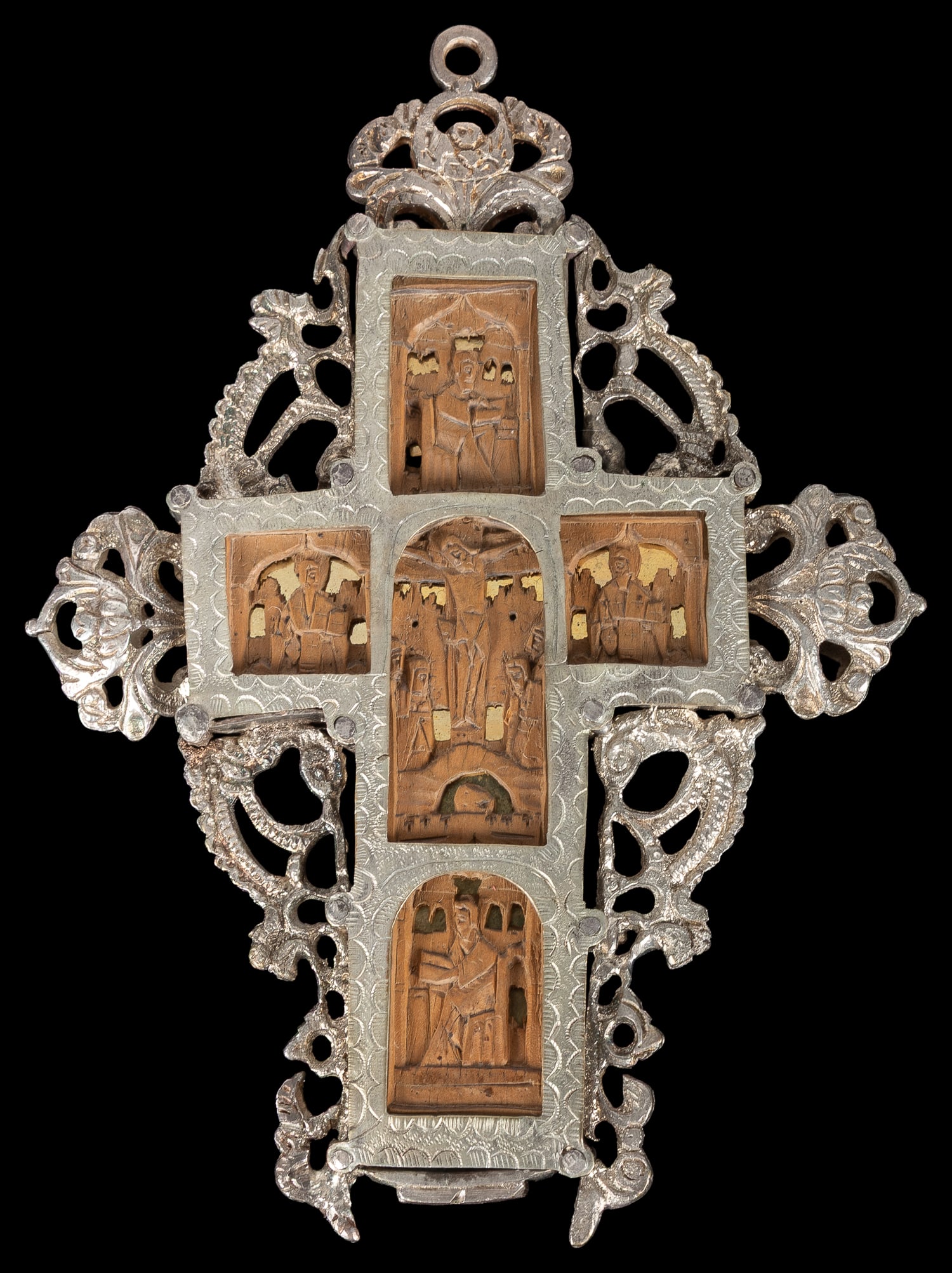 Greek silver and carved wood Mount Athos cross.: Greek silver and carved wood Mount Athos cross. Circa 19th century. Cross with micro-carved sections on front and back of the life of Christ, in an ornate silver frame. 5 x 3 3/4".