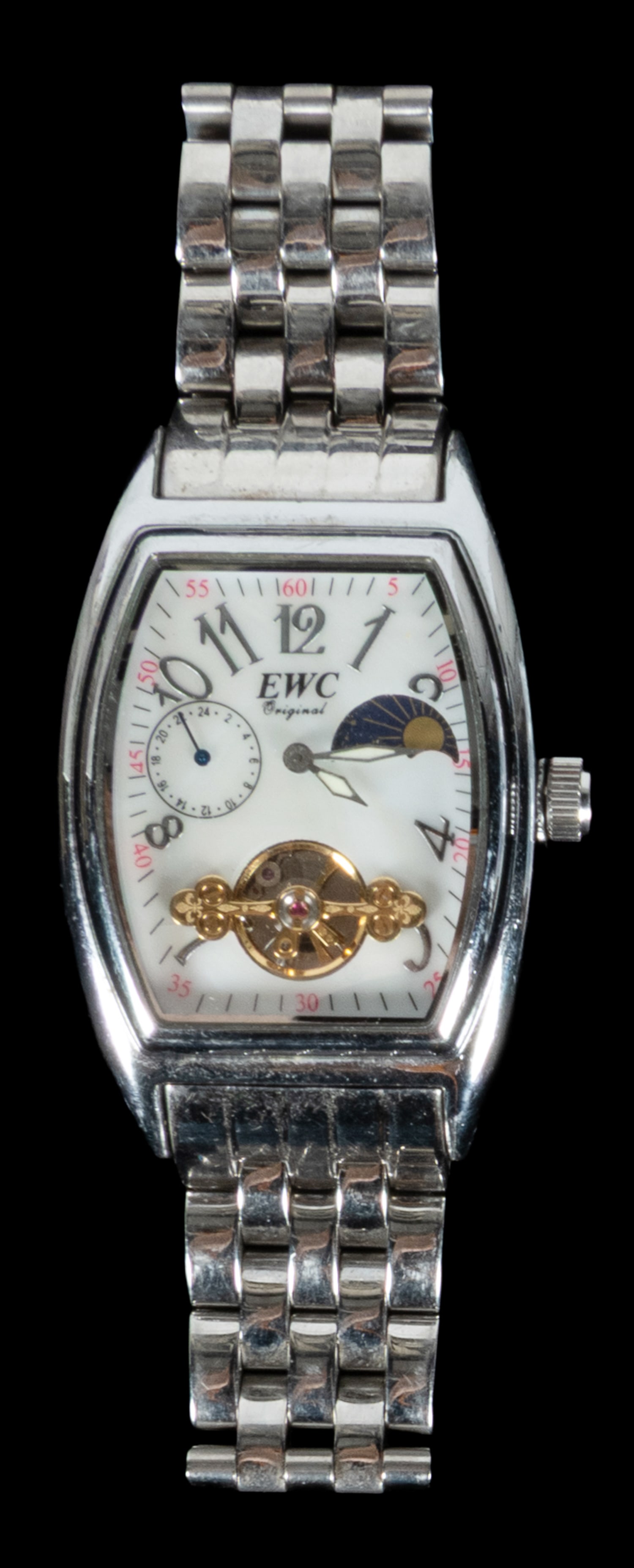 EWC erotic men's wristwatch.: EWC erotic men's wristwatch. 20th century. Stainless steel case and band, with moon phase indicator, seconds dial, the reverse with erotic vignette in heart-shaped opening. Total weight approx. 5.2 oz